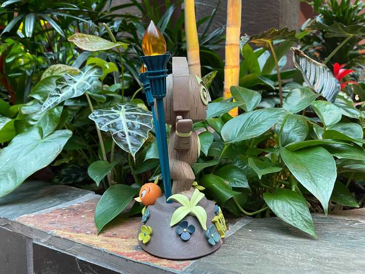 PHOTOS: New Maui and Orange Bird Light-Up Statue Released at Disney's Polynesian Village Resort 4 disneys-polynesian-village-resort-tiki-orange-bird-statue-side-right-plants
