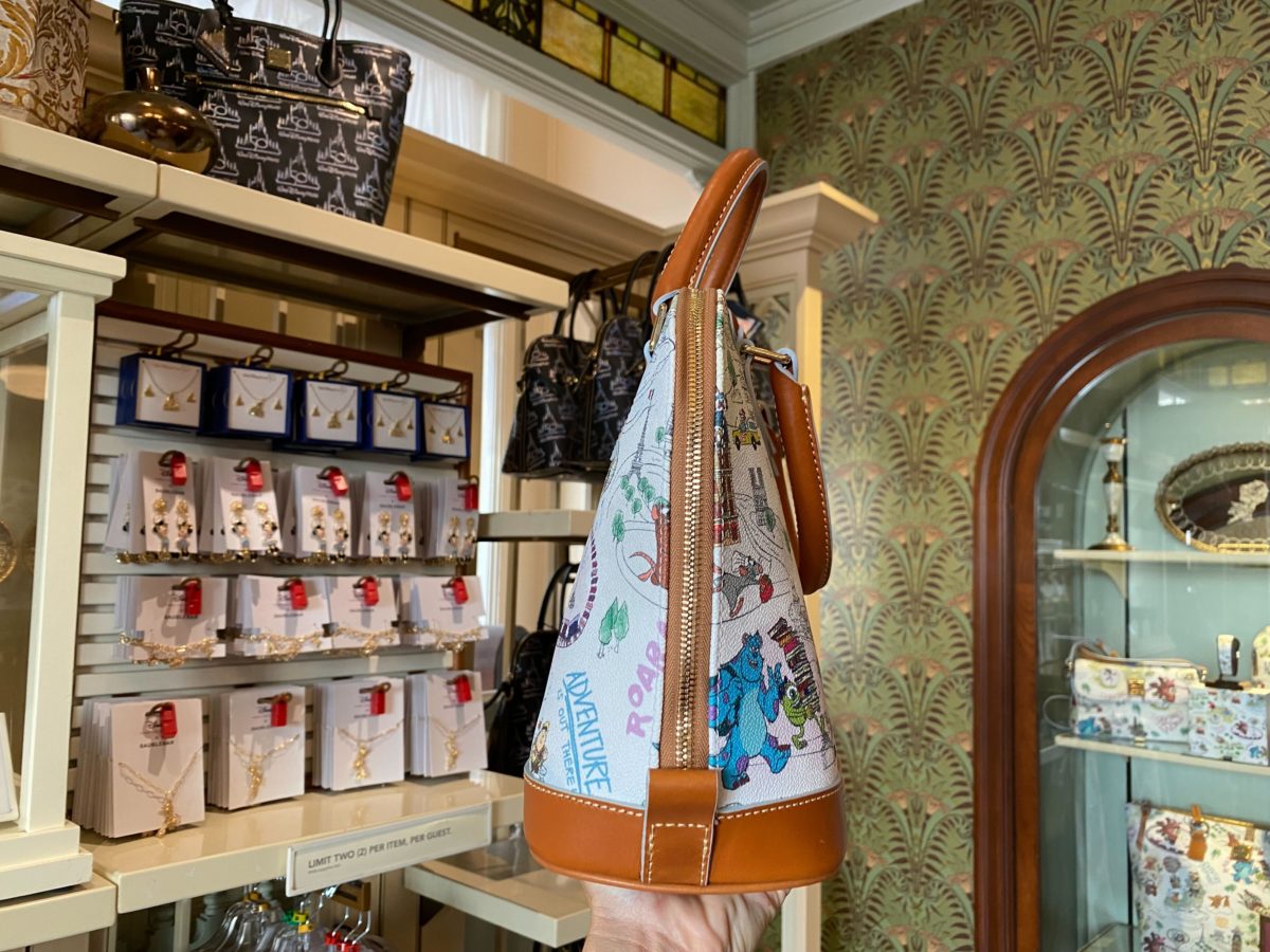 PHOTOS: NEW Dooney & Bourke it's a small world Collection Sailing Into  Walt Disney World on June 14th - WDW News Today