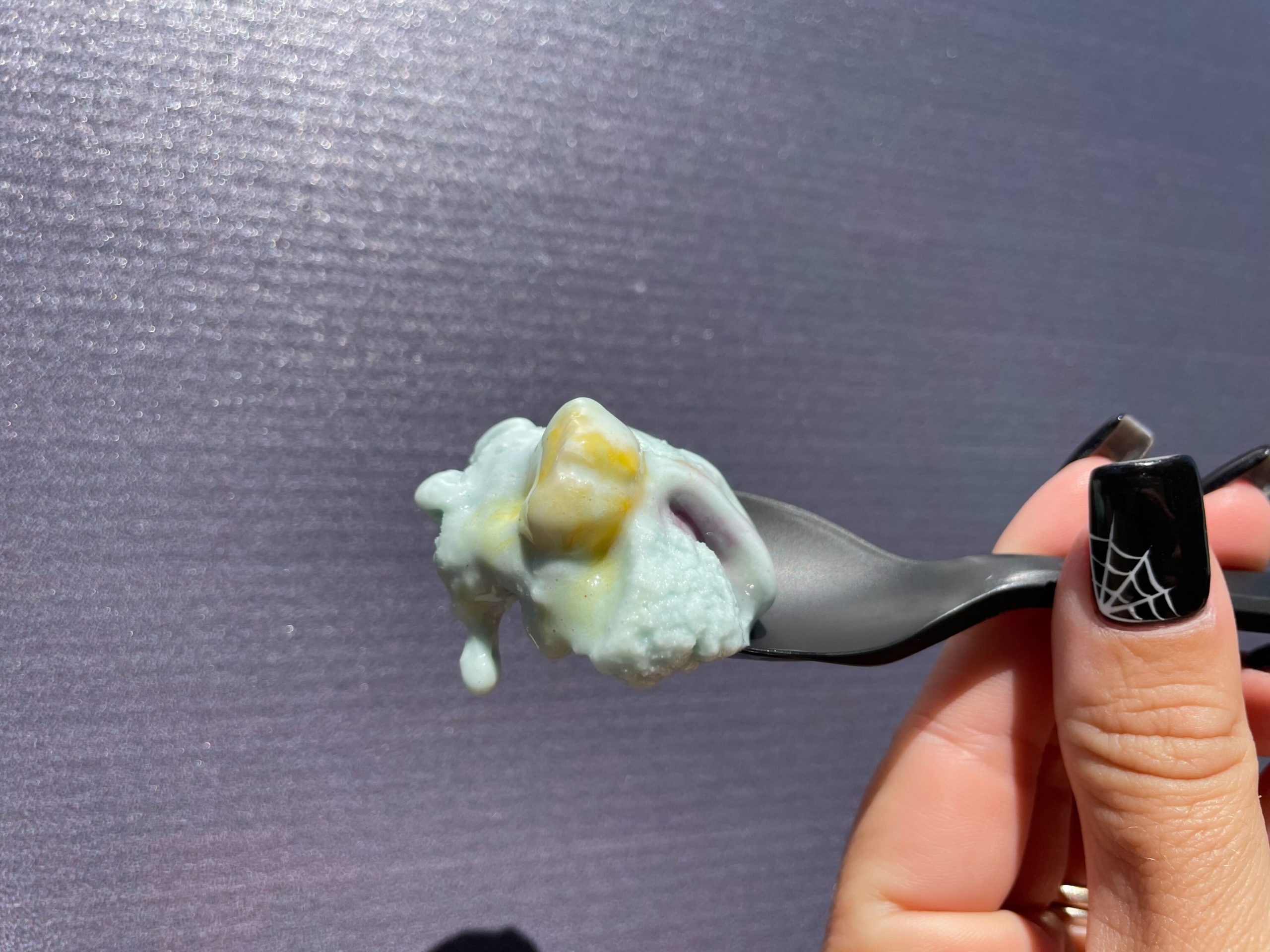 Spoon with a bite of Salt & Straw Double Bubble Toil and Trouble vegan bubblegum ice cream.