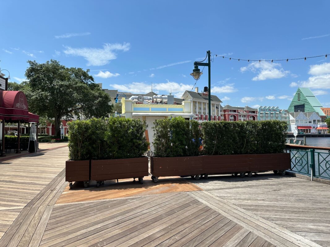 Rolling planters set up around Blue Ribbon Corn Dog.