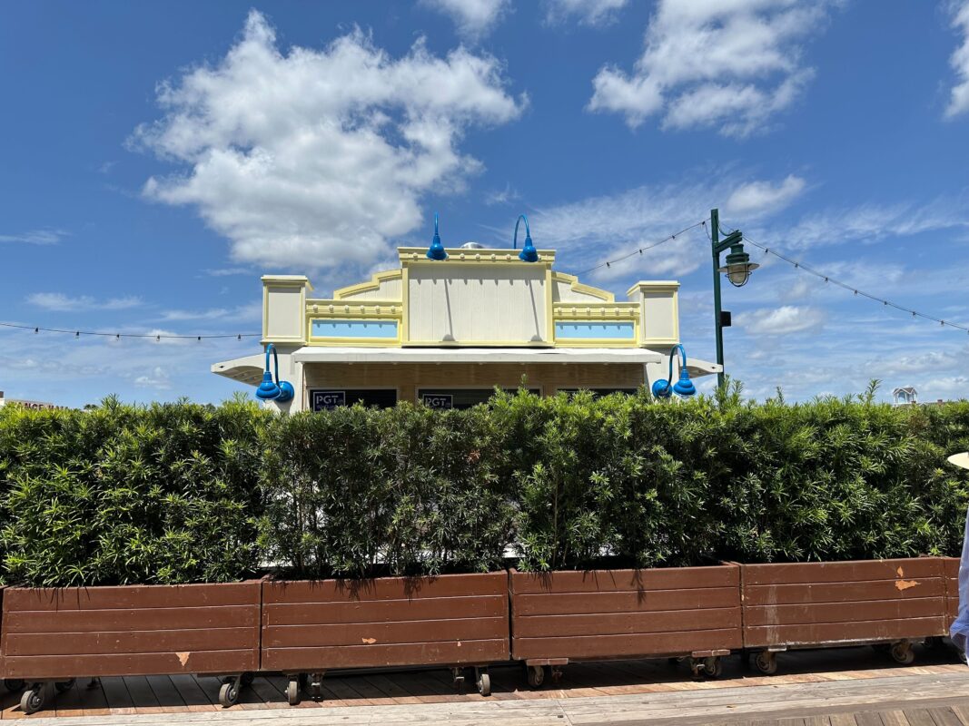 A view of Blue Ribbon Corn Dog from the front, behind rolling planters.