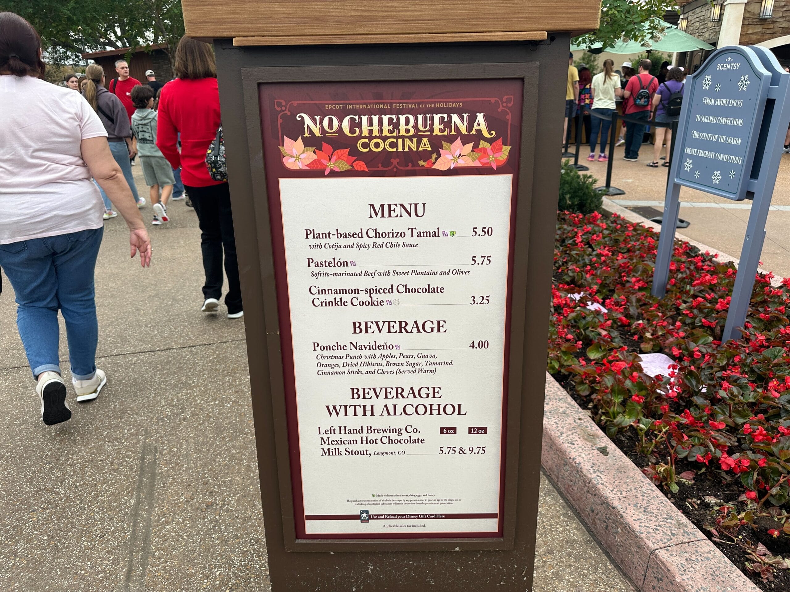 The menu board at Nochebuena Cocina features plant-based chorizo tamal, pasatela, and cinnamon-spiced cookies, perfectly paired with beverages like ponche navideño and Mexican hot chocolate.
