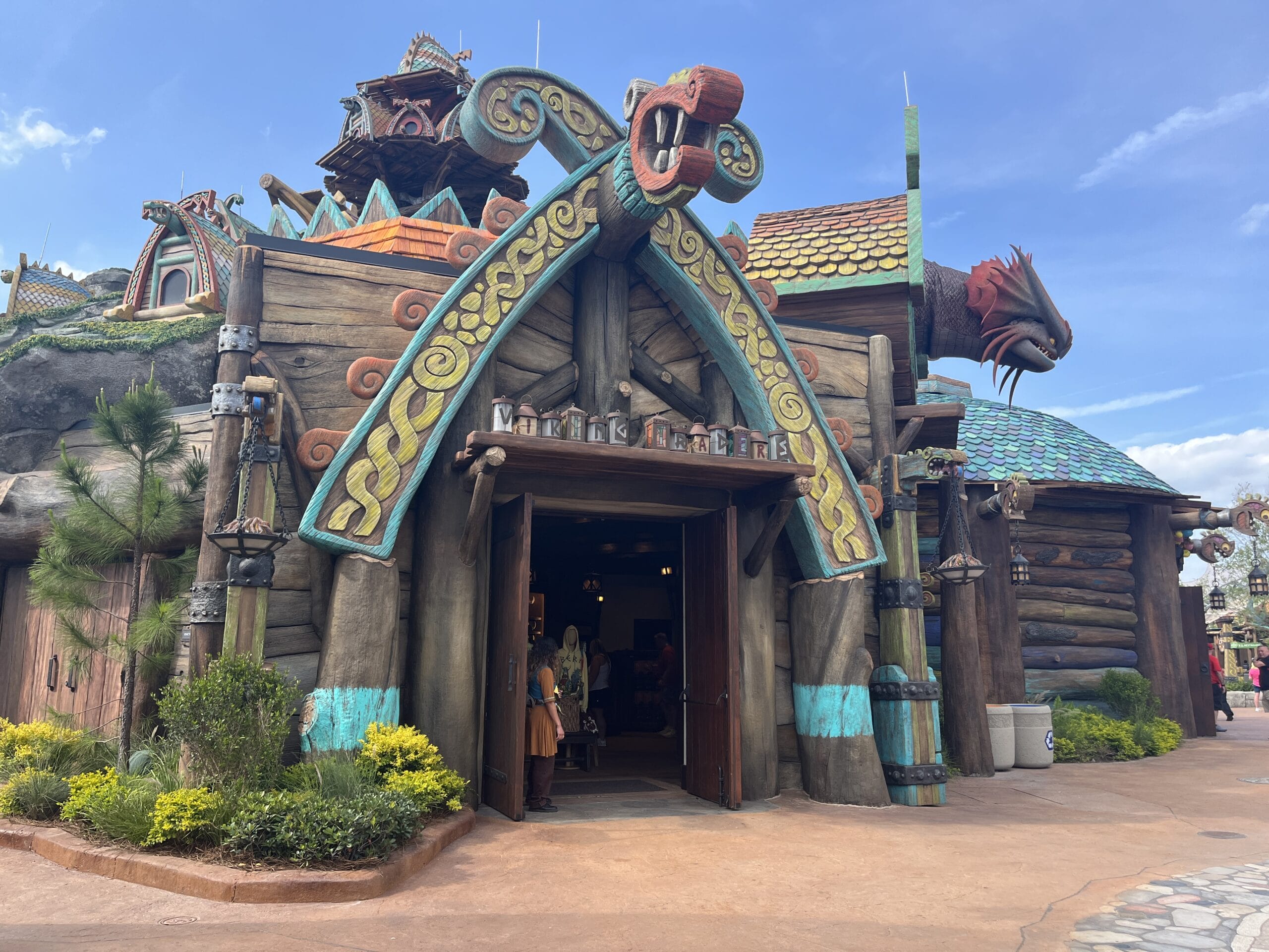 A Viking Traders-inspired building featuring a dragon head, distinct from any Disney castle like those at Magic Kingdom or Disneyland.