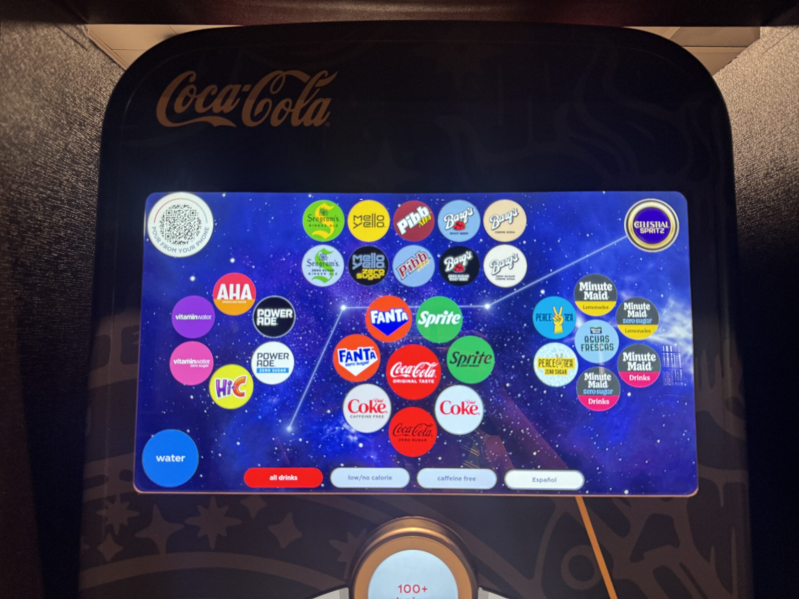 Coca-Cola freestyle machine screen at Pizza Moon Restaurant in Epic Universe’s Celestial Park, showing drink options.