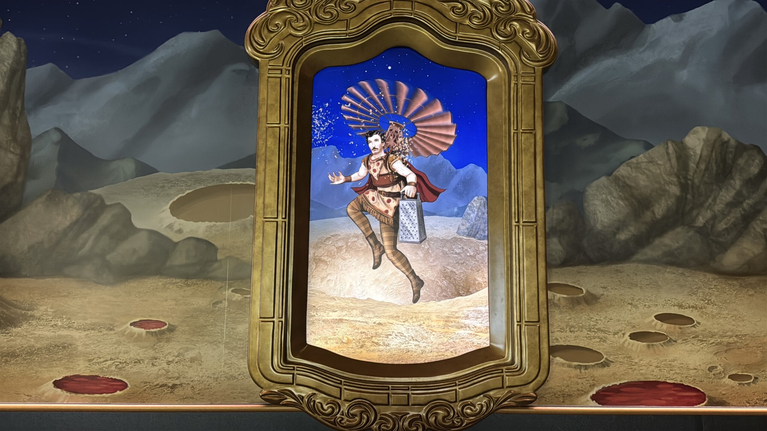 A framed painting of a fantasy warrior with wings, set in Epic Universe beneath a starry sky and cratered landscape.