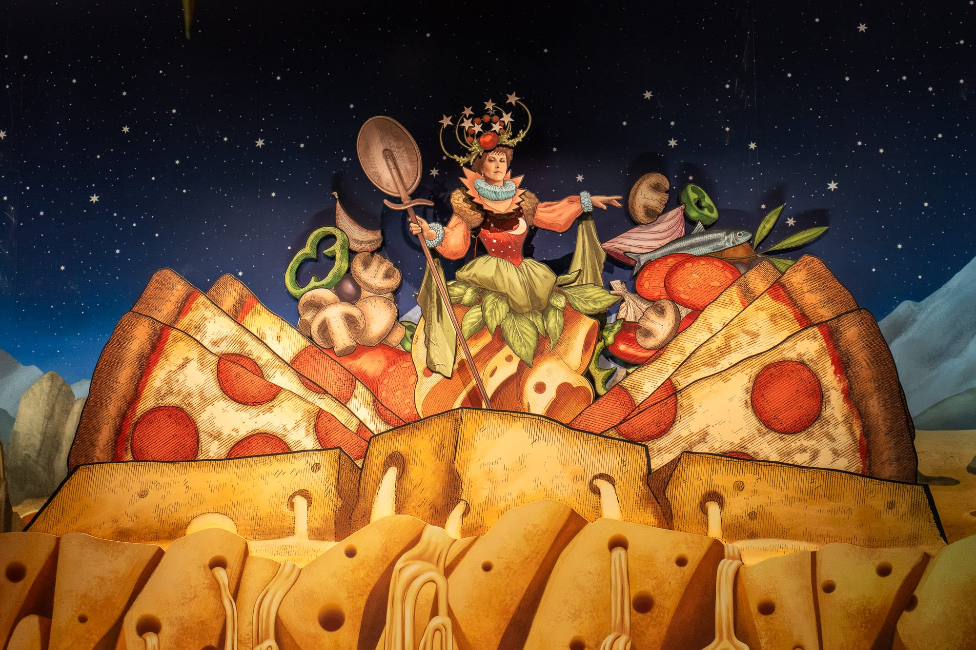 A whimsical queen sits atop giant pizza slices at Pizza Moon Restaurant, surrounded by floating vegetables.