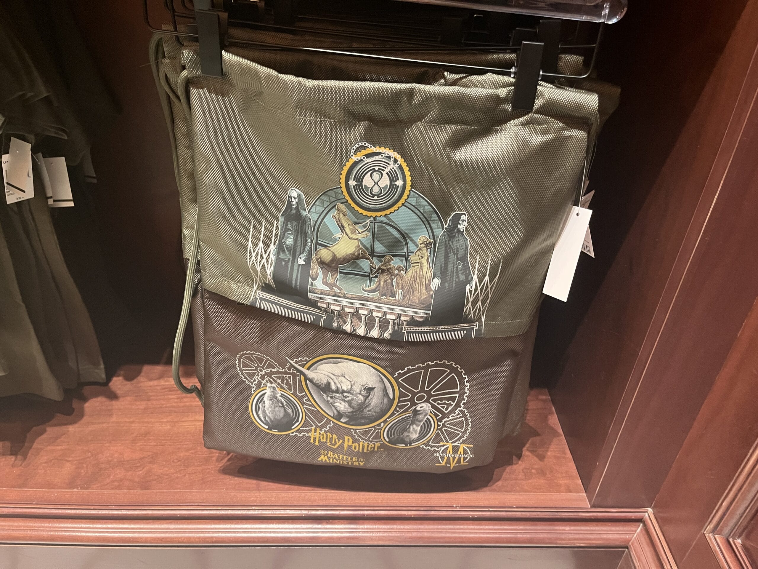 Olive Harry Potter backpack with character art, magical symbols, and Epic Universe Wizarding World of Harry Potter design.