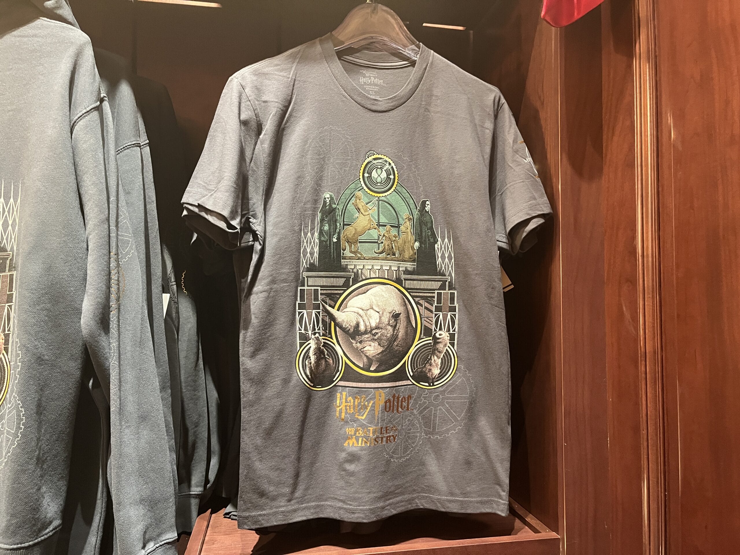 Dark Harry Potter T-shirt from the Wizarding World of Harry Potter merchandise, with magical creatures and “Beastly Manner.”