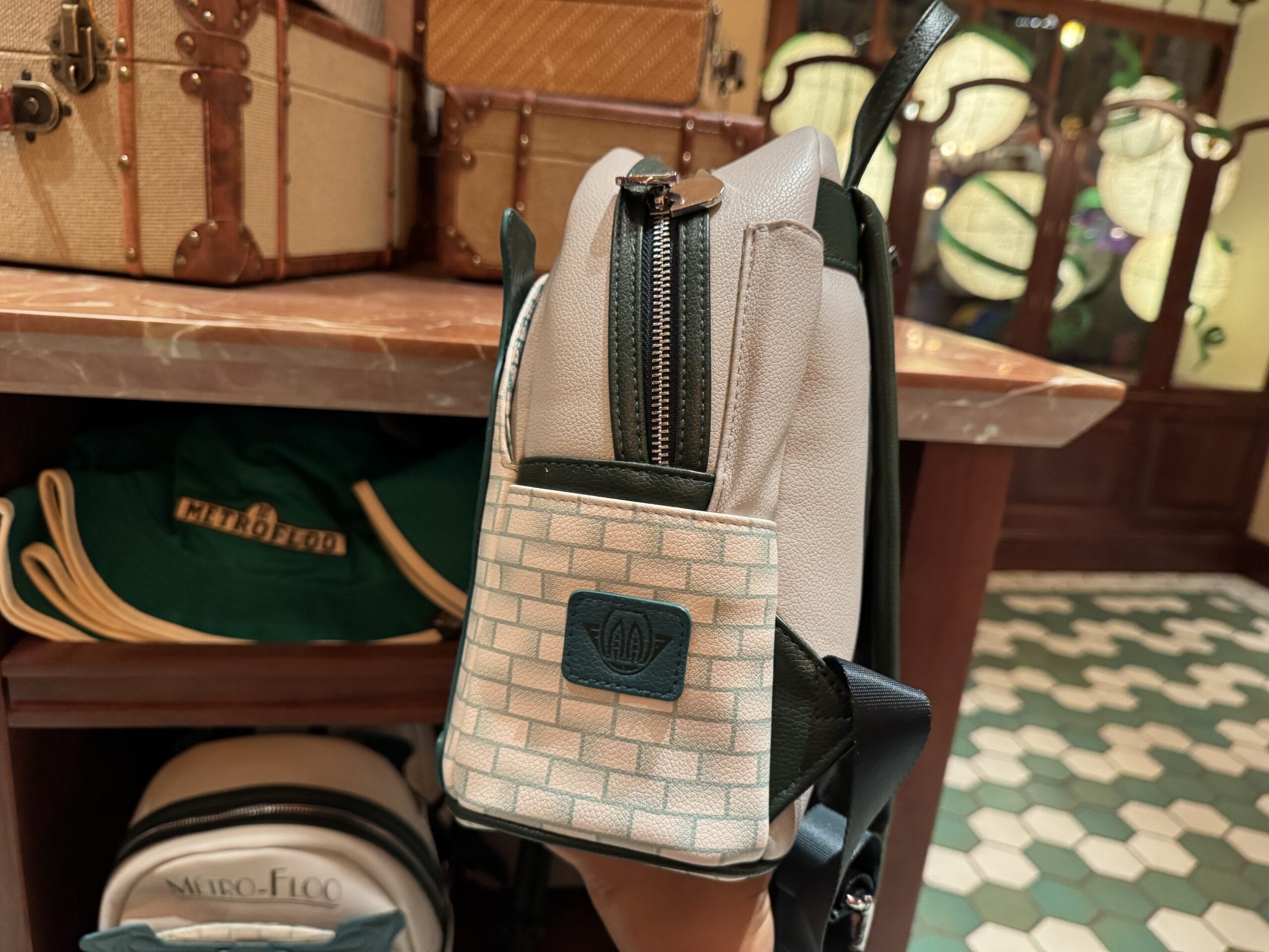 A small backpack with a brick pattern and Fiat logo, perfect Wizarding World of Harry Potter merchandise at Epic Universe.
