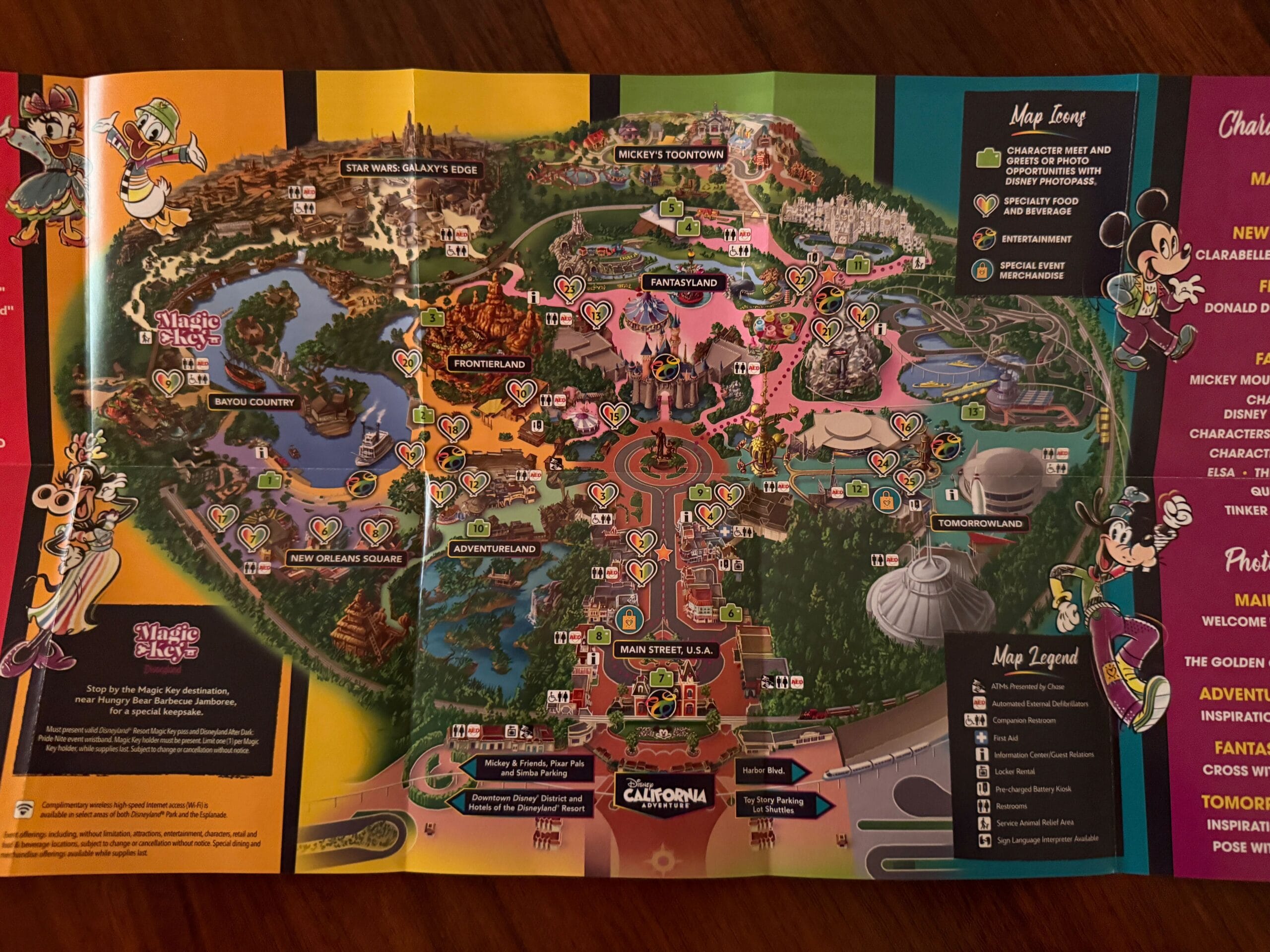 Colorful Disneyland Pride Nite 2025 map featuring themed lands, attractions, and cartoon characters around the edges.