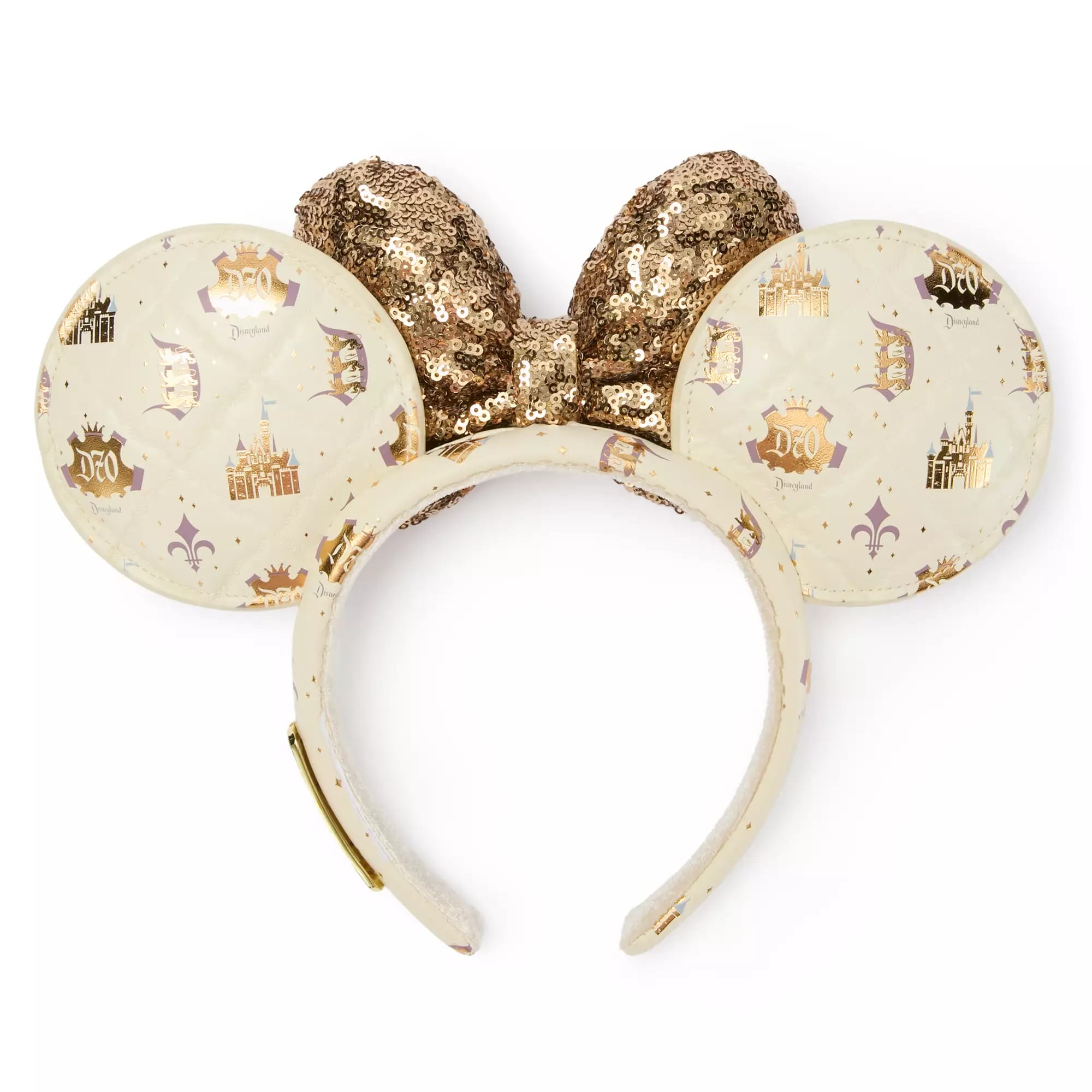 A cream headband with gold sequined bow and round ears featuring Disneyland logos and castle designs.