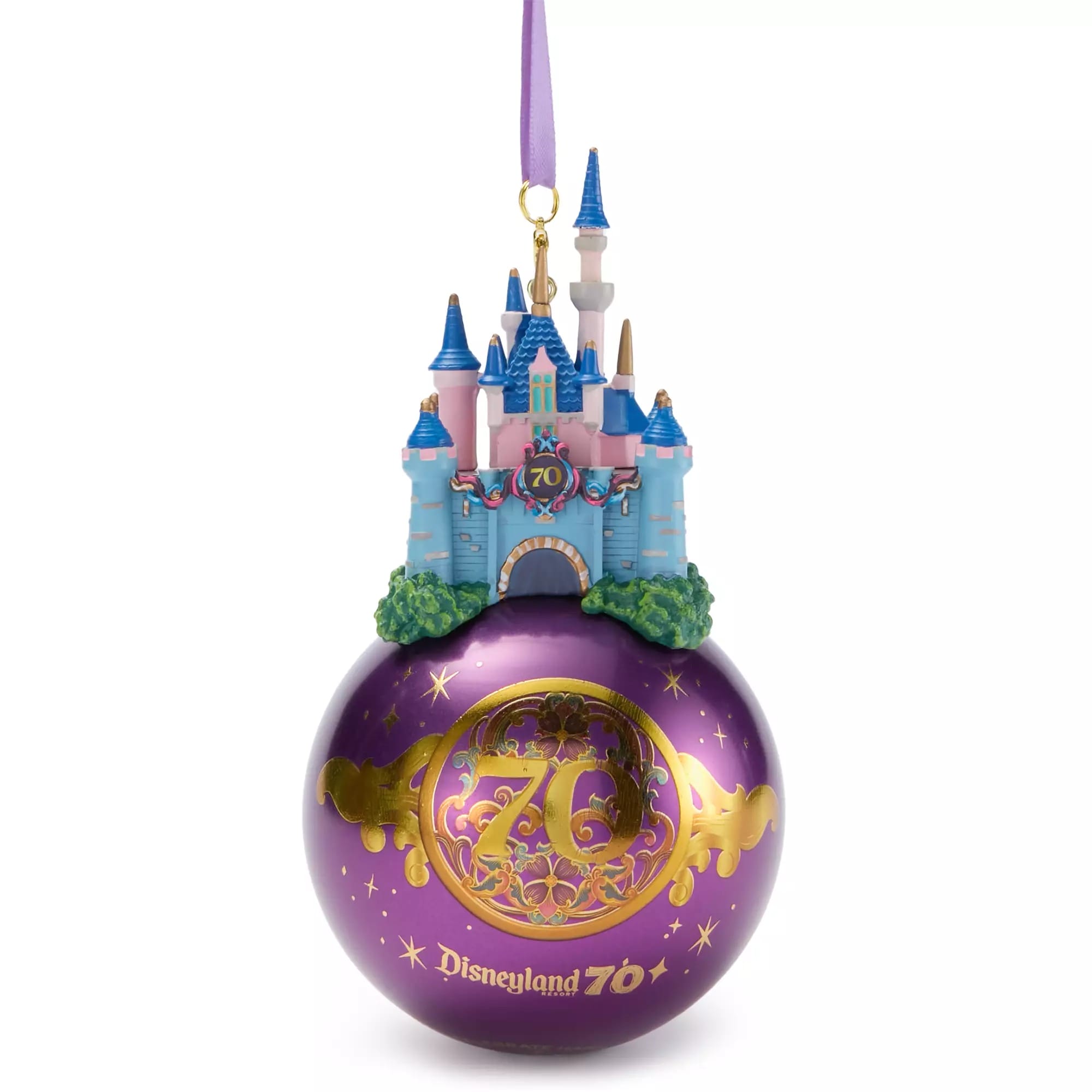 A purple Disneyland 70th anniversary ornament with a Sleeping Beauty Castle decoration on top.