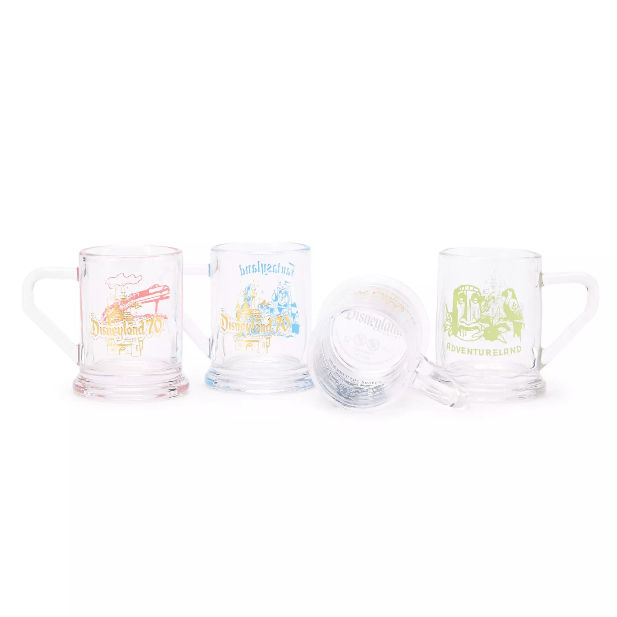 Four clear mugs feature colorful Disneyland 70th anniversary park-themed graphics and logos on a white background.