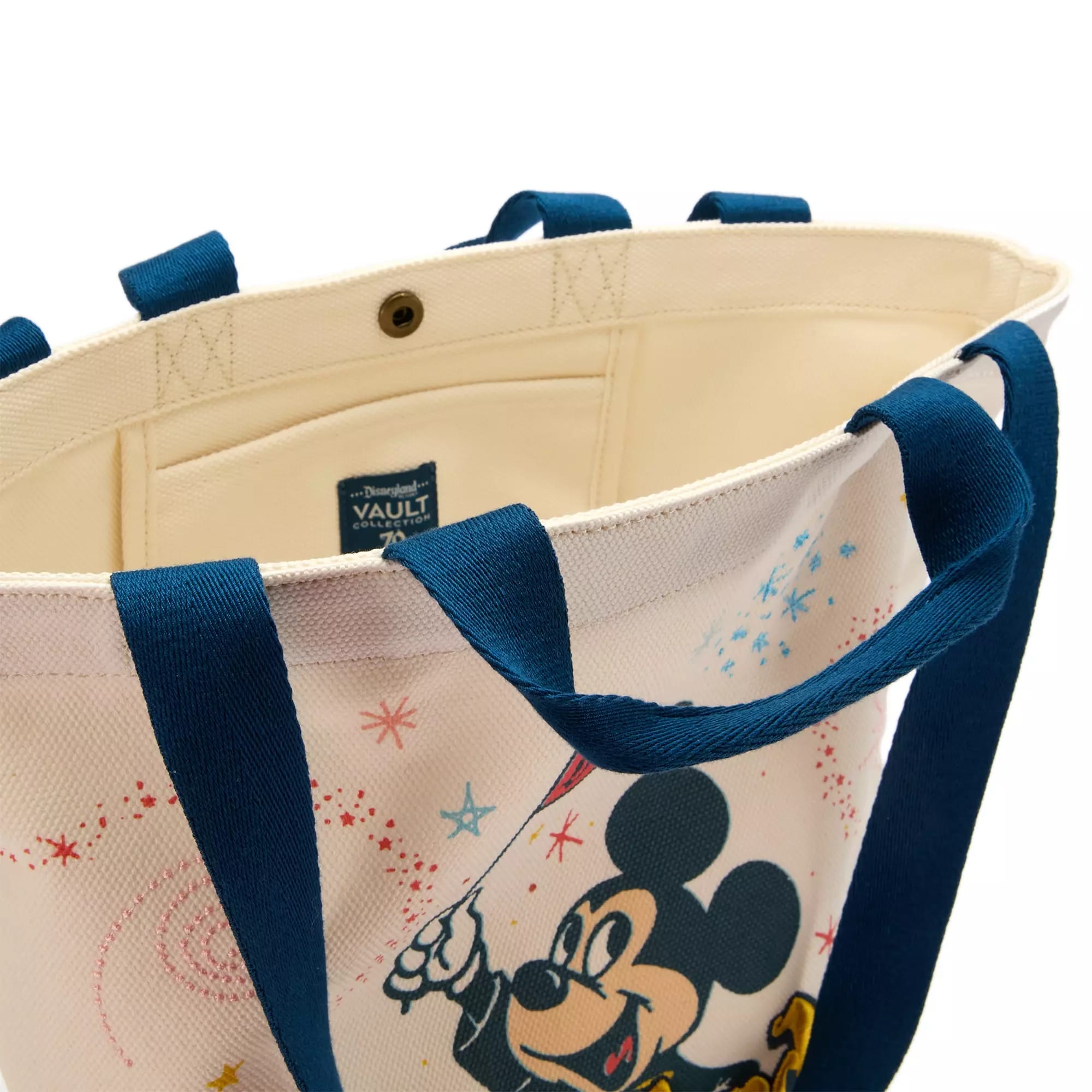 Canvas tote bag with blue handles, featuring a colorful print of Mickey Mouse and fireworks design.