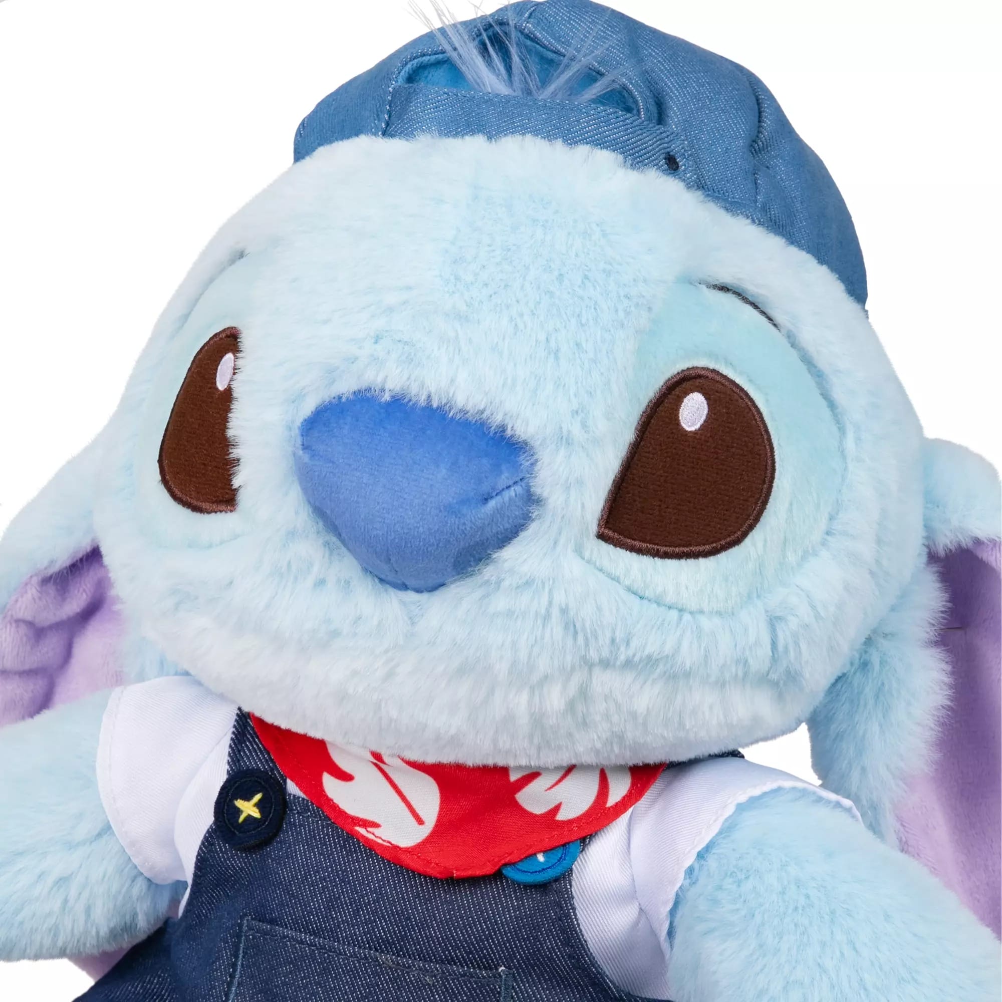 A blue Stitch plush in overalls, red bandana, and cap, with big brown eyes—exclusive from Disney Store China.