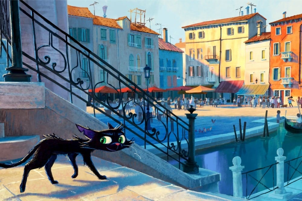 A black cat with green eyes walks down stone steps by a canal in a colorful, sunlit European town square.