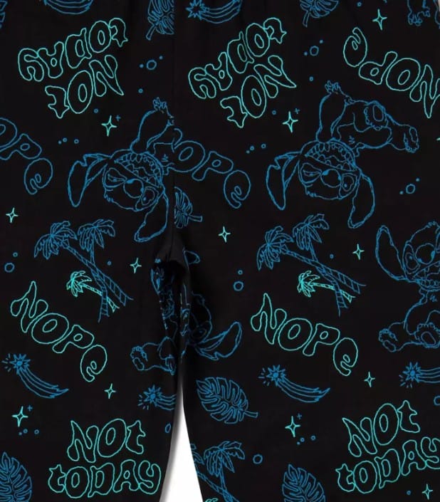 Black fabric apparel with blue outlines of sloths, palm trees, and playful "NOPE" and "NOT TODAY" text—fun merchandise!