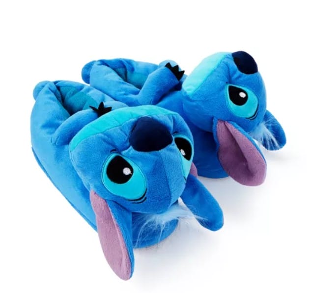 Pair of blue Lilo & Stitch slippers with large eyes, floppy ears, and plush details, perfect for cozy merchandise lovers.