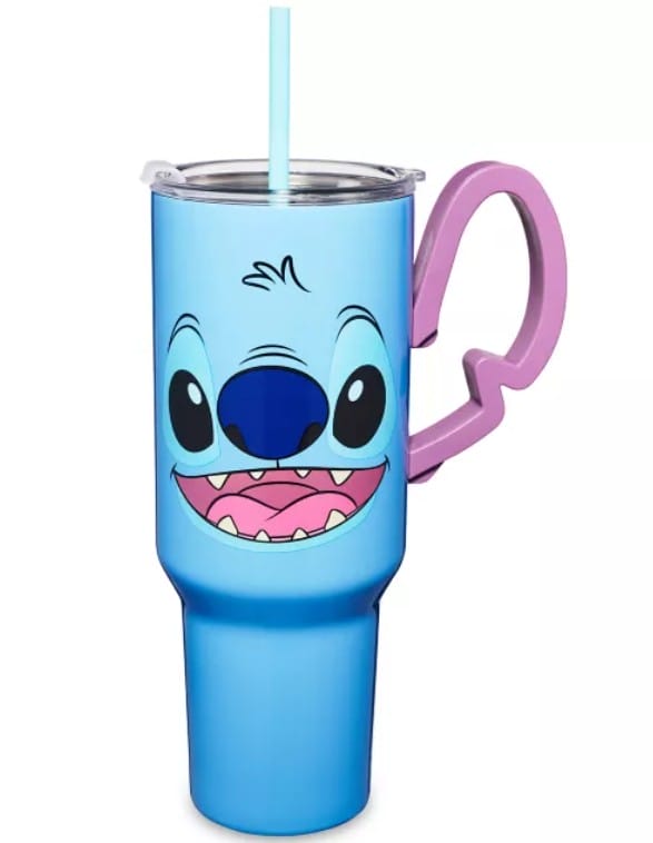 Blue Lilo & Stitch tumbler from Spencer's with Stitch's face, a purple ear handle, and a blue straw.