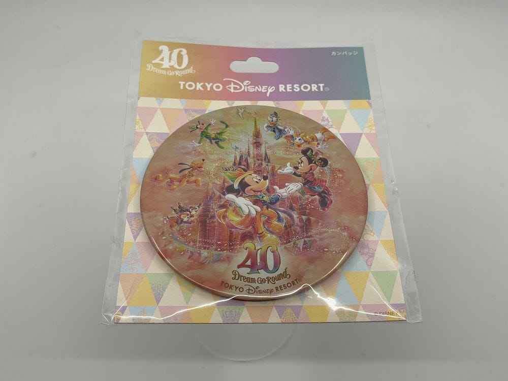 Round souvenir with Disney characters and Cinderella Castle for Tokyo Disney Resort’s 40th—bid in the WDWNT Summer Auction!