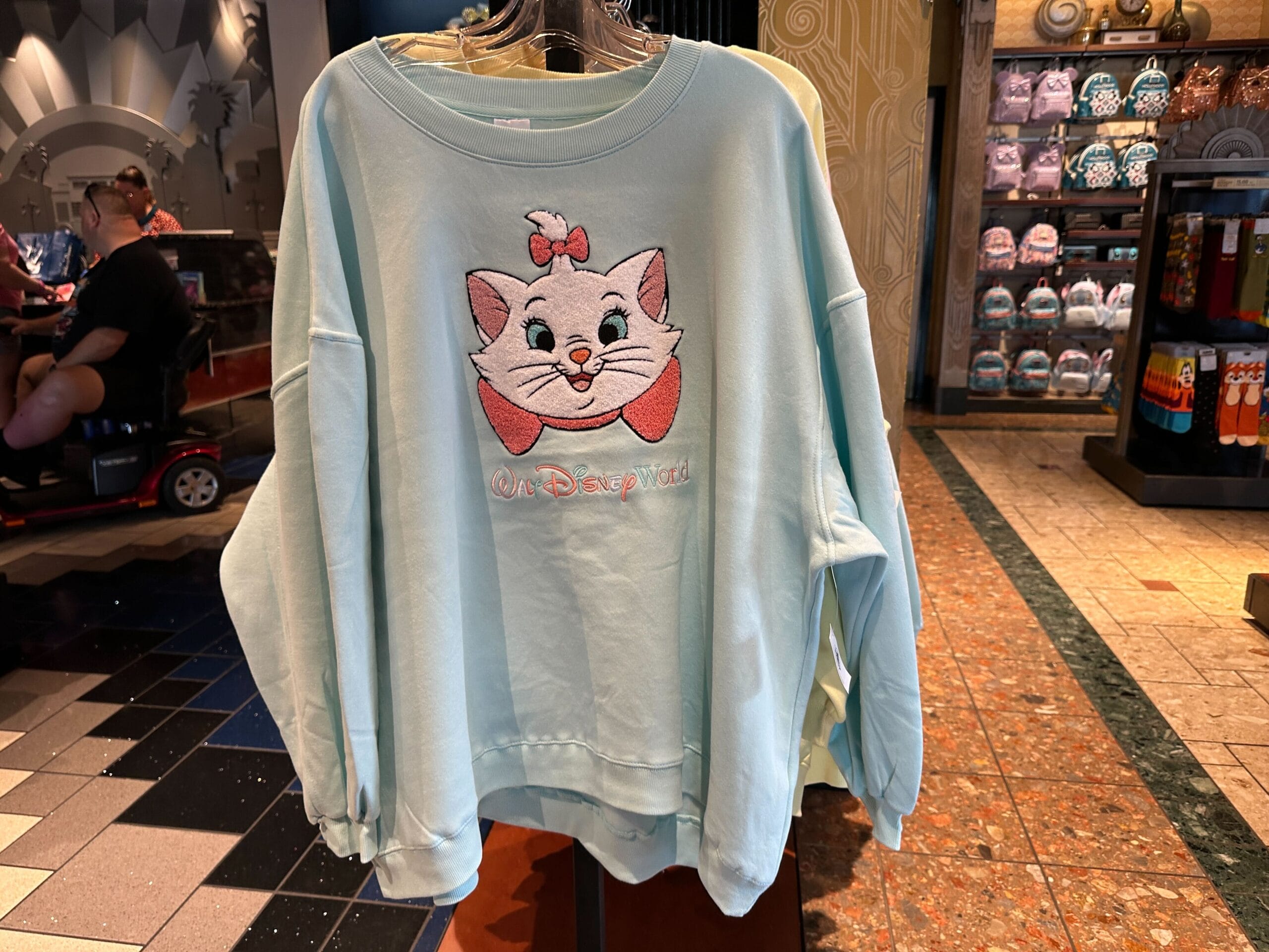 New Arrivals: Light blue Character Sweatshirt featuring Marie from "The Aristocats" and "Oh Disneyland!" embroidered in front.