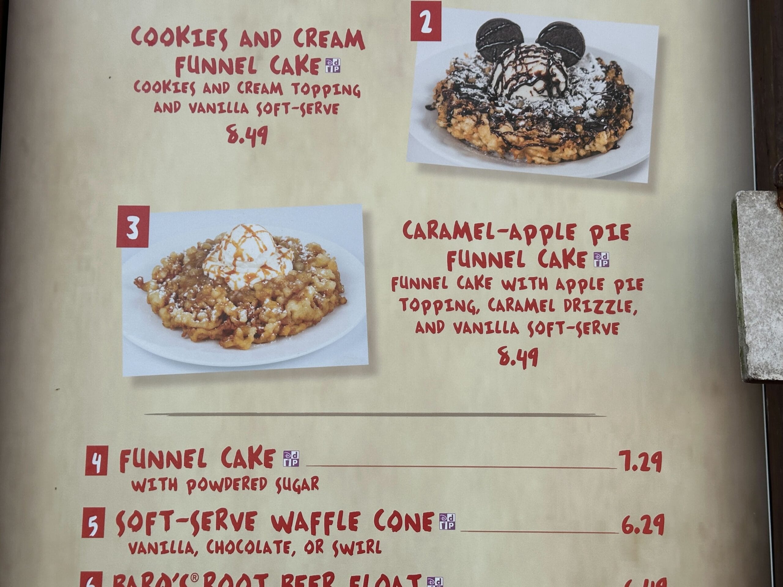 Menu showing cookies and cream and caramel-apple pie funnel cakes, plus funnel cake, waffle cone, and root beer float.