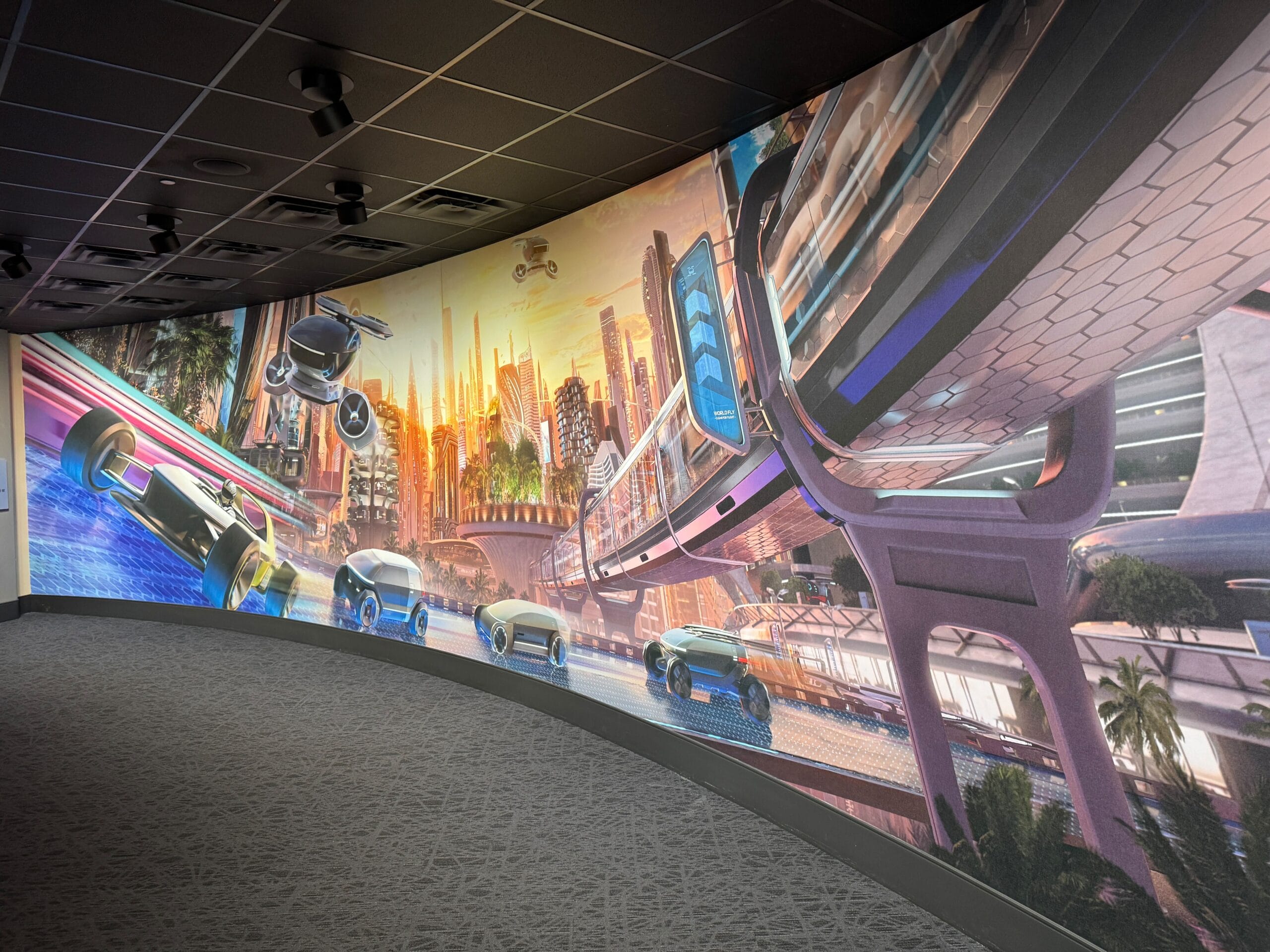 Futuristic mural featuring flying cars, Test Track-inspired transit, and modern buildings in a vibrant cityscape.