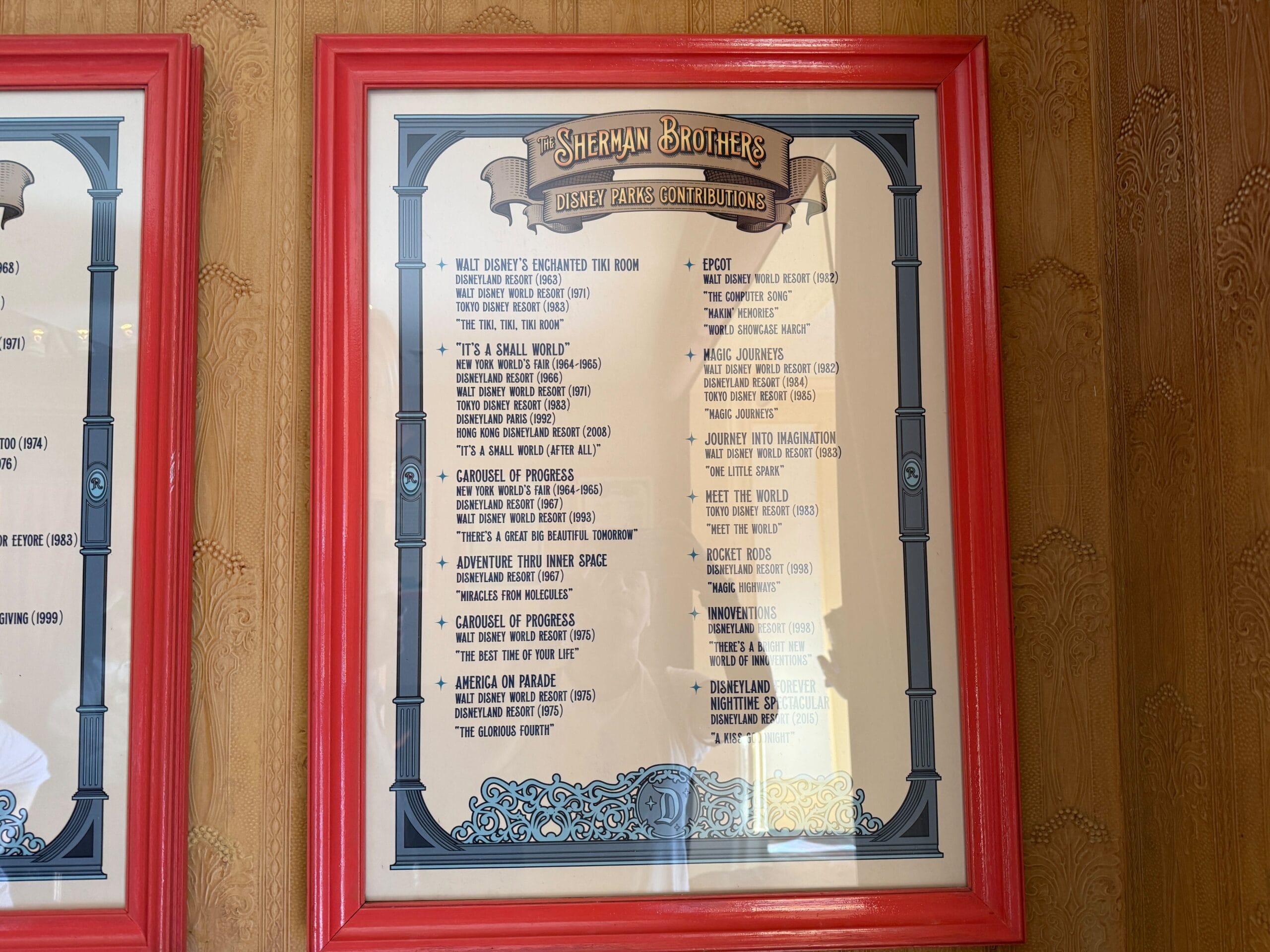 Framed Sherman Brothers Tribute: Disney Parks songs, beige background, red border—perfect for any Disneyland 70 fan.