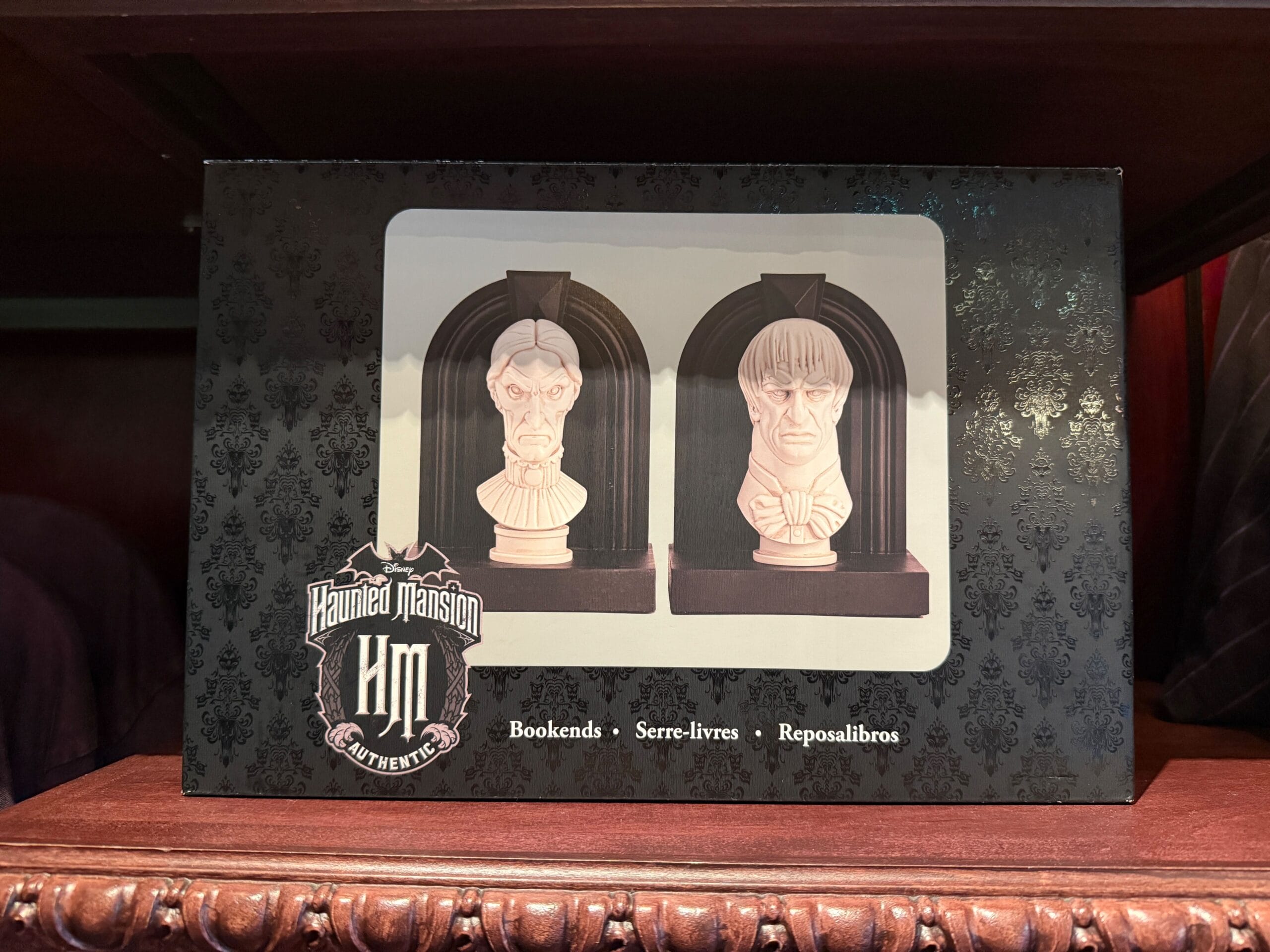 Box of Haunted Mansion bookends—Disneyland HM Merchandise featuring two stern-faced white busts on black bases.
