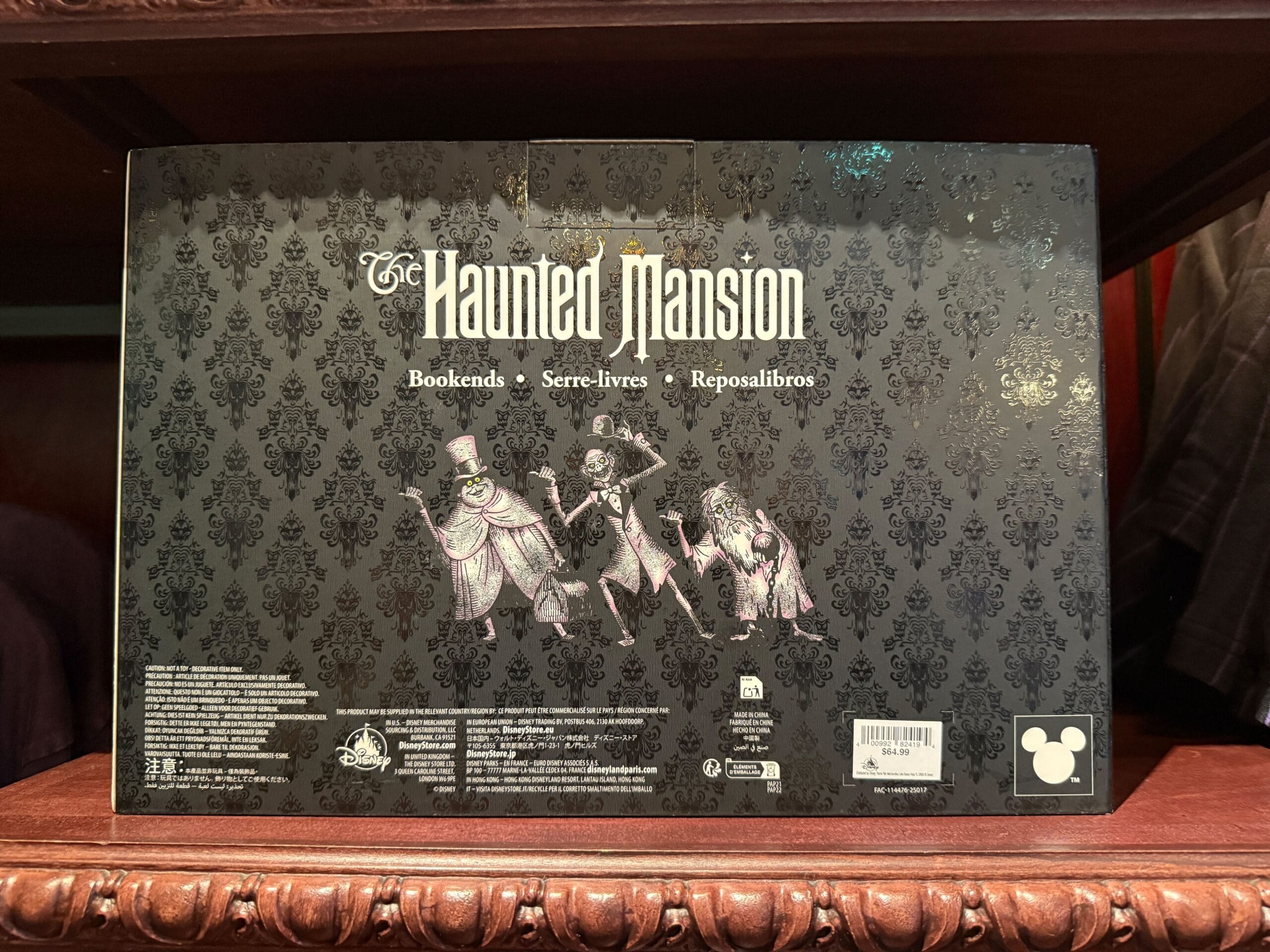 The Haunted Mansion bookends box features three ghostly characters and ornate black patterned background—perfect HM Merchandise.