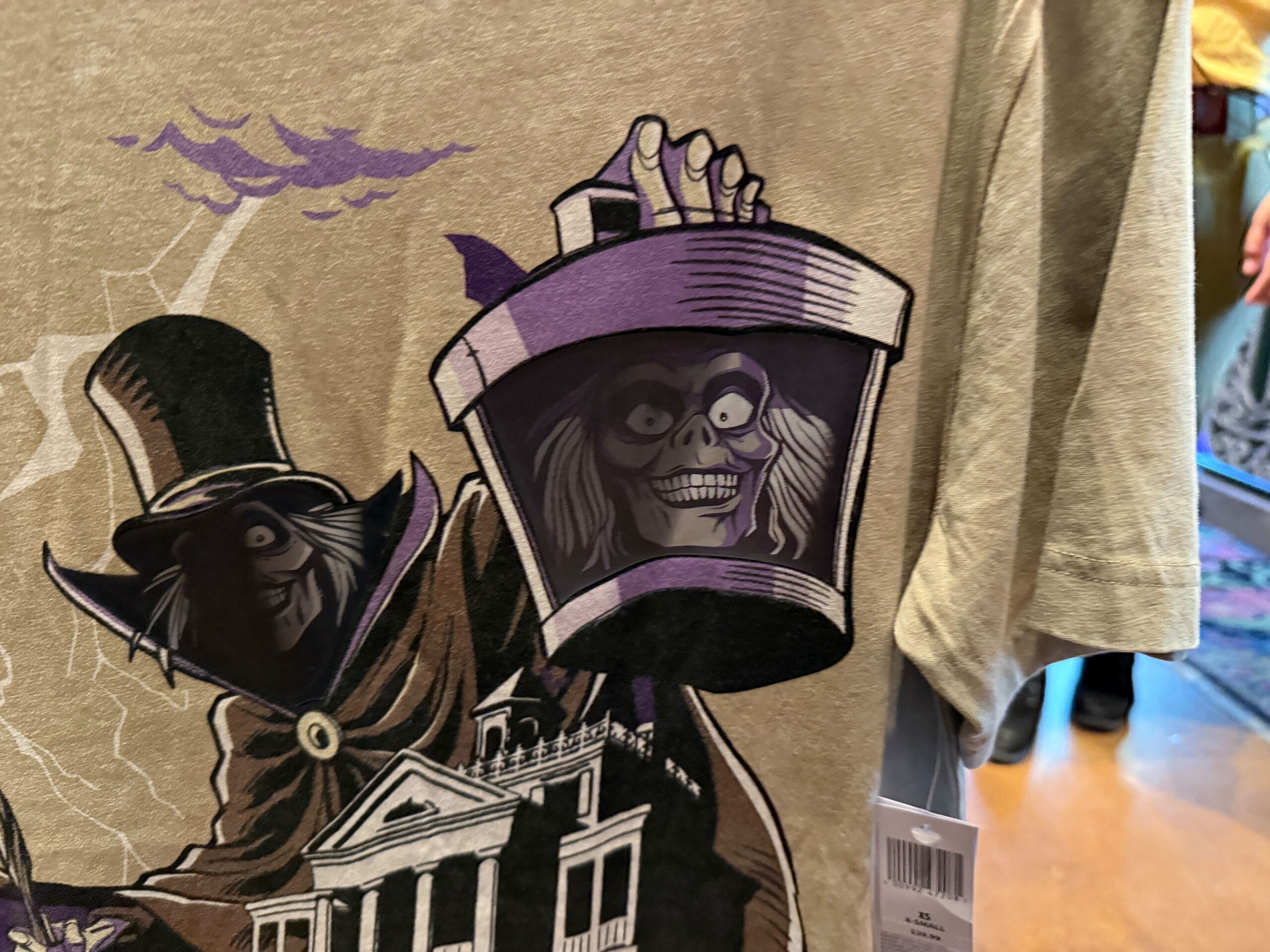 Illustration of a ghostly figure holding a lantern with a creepy, grinning face, inspired by Disneyland HM Merchandise.