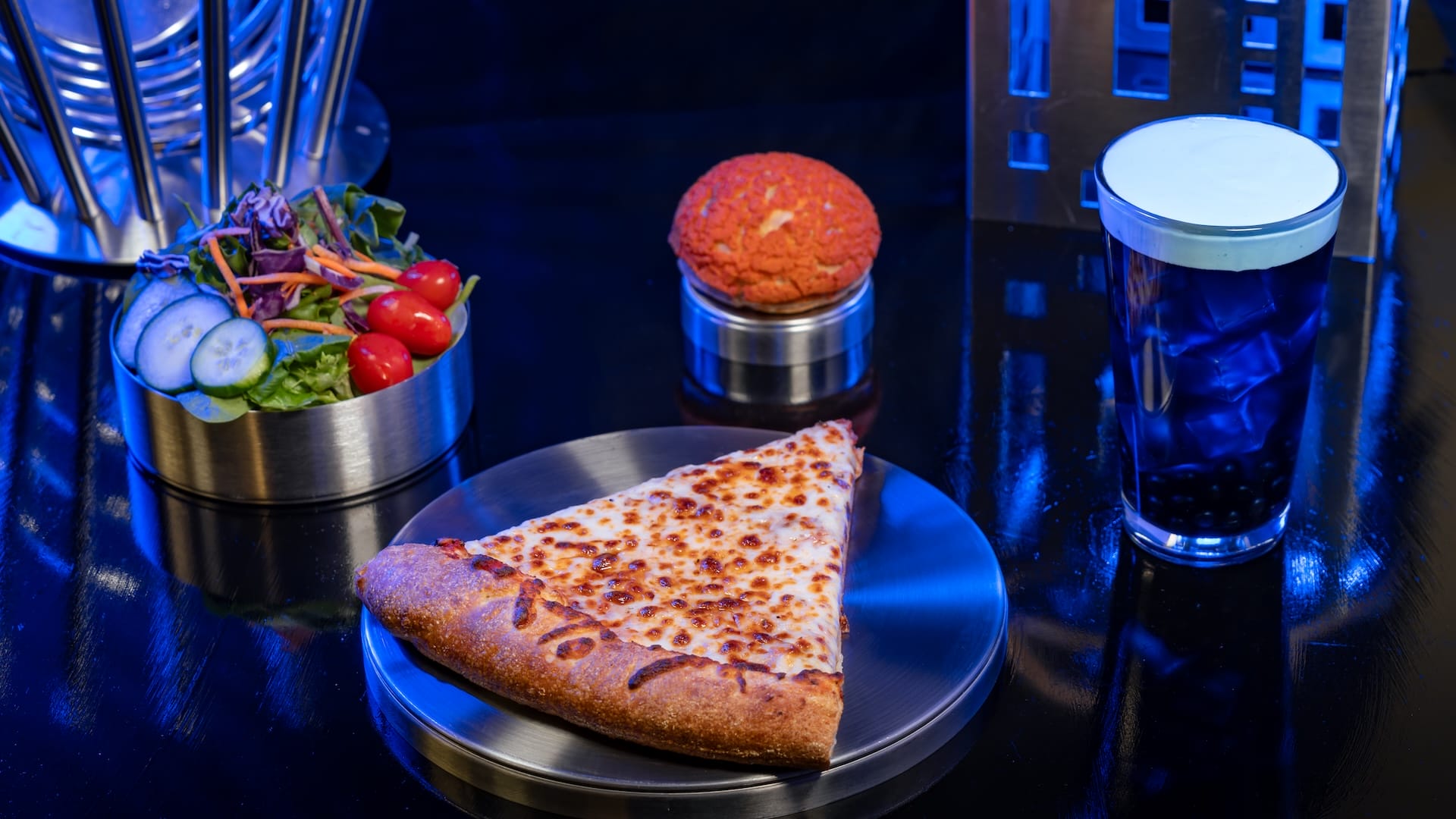 A slice of cheese pizza, salad, orange-topped bun, and blue bubble tea—classic Food and Beverages ensemble.