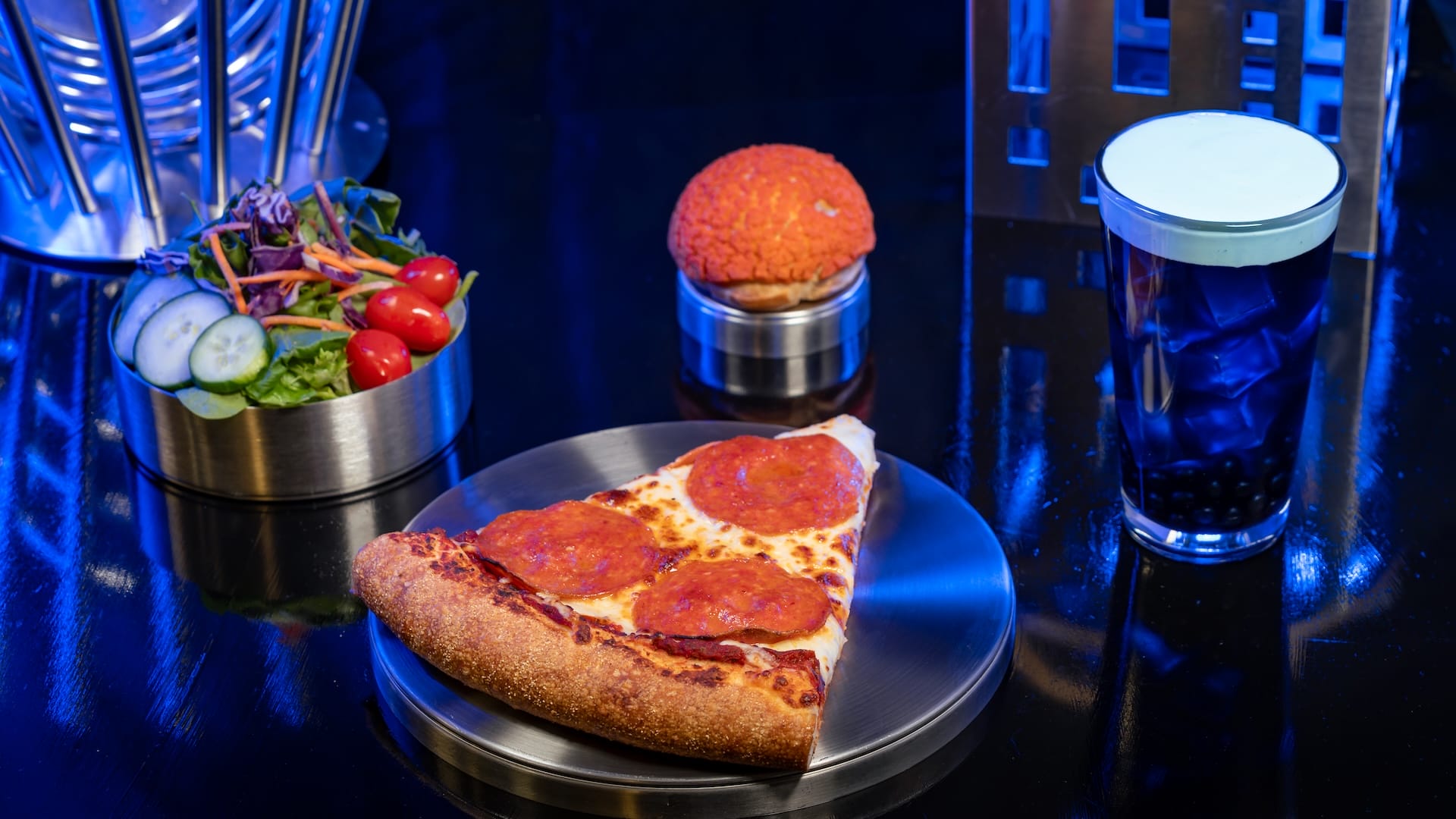 A slice of pepperoni pizza, salad, pastry, and bubble tea—perfect food and beverages for Fantastic Four fans.