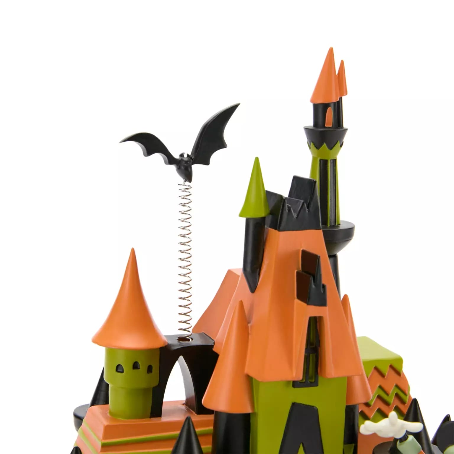 A whimsical orange and black haunted house inspired by new Disney Store Halloween merchandise, with a bat on a spring.