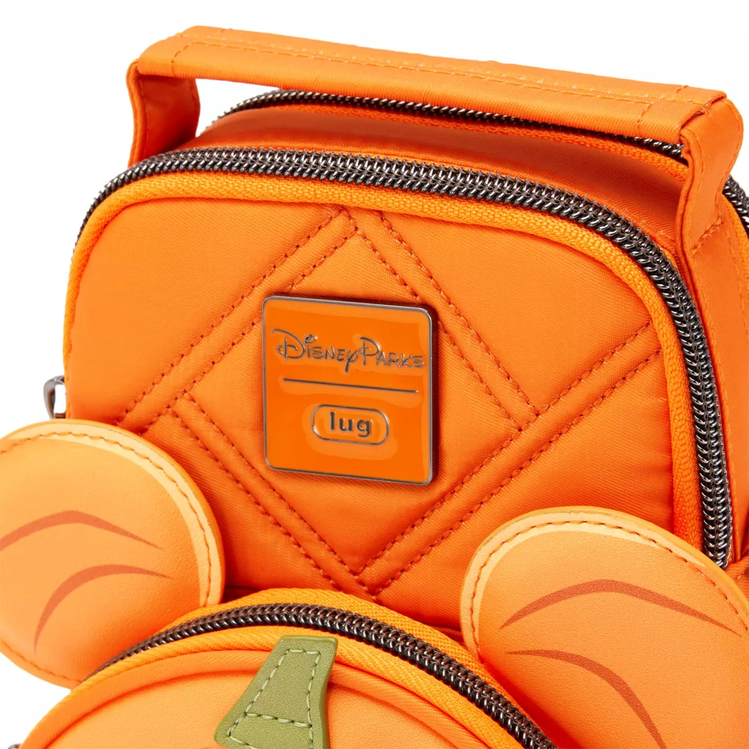 Close-up of a new Disney Store Halloween merchandise bag with zippered compartments and cartoon character ear details.