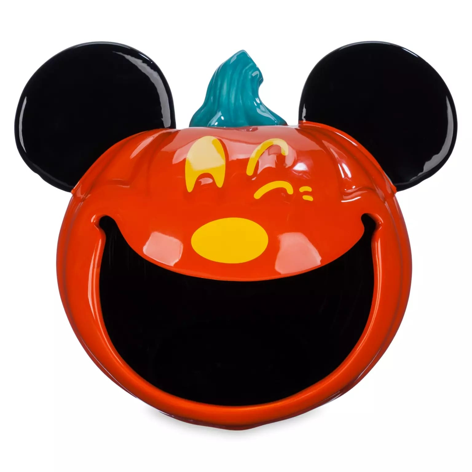 A pumpkin-shaped container with Mickey Mouse ears, part of Disney Store Halloween merchandise, winks with a big open mouth.