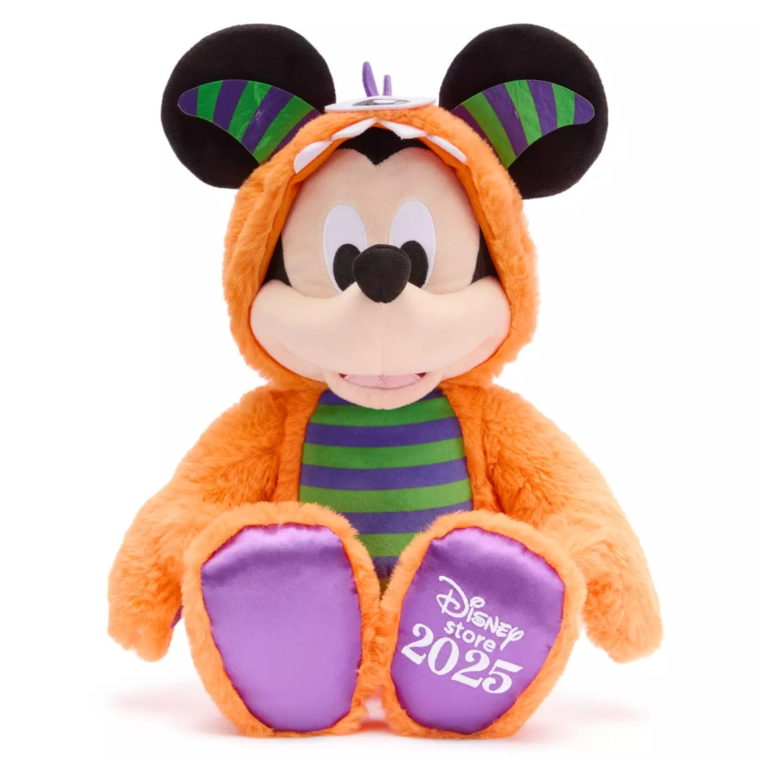 Plush Mickey Mouse in orange costume, part of new Disney Store products, "Disney Store 2025" on left foot.