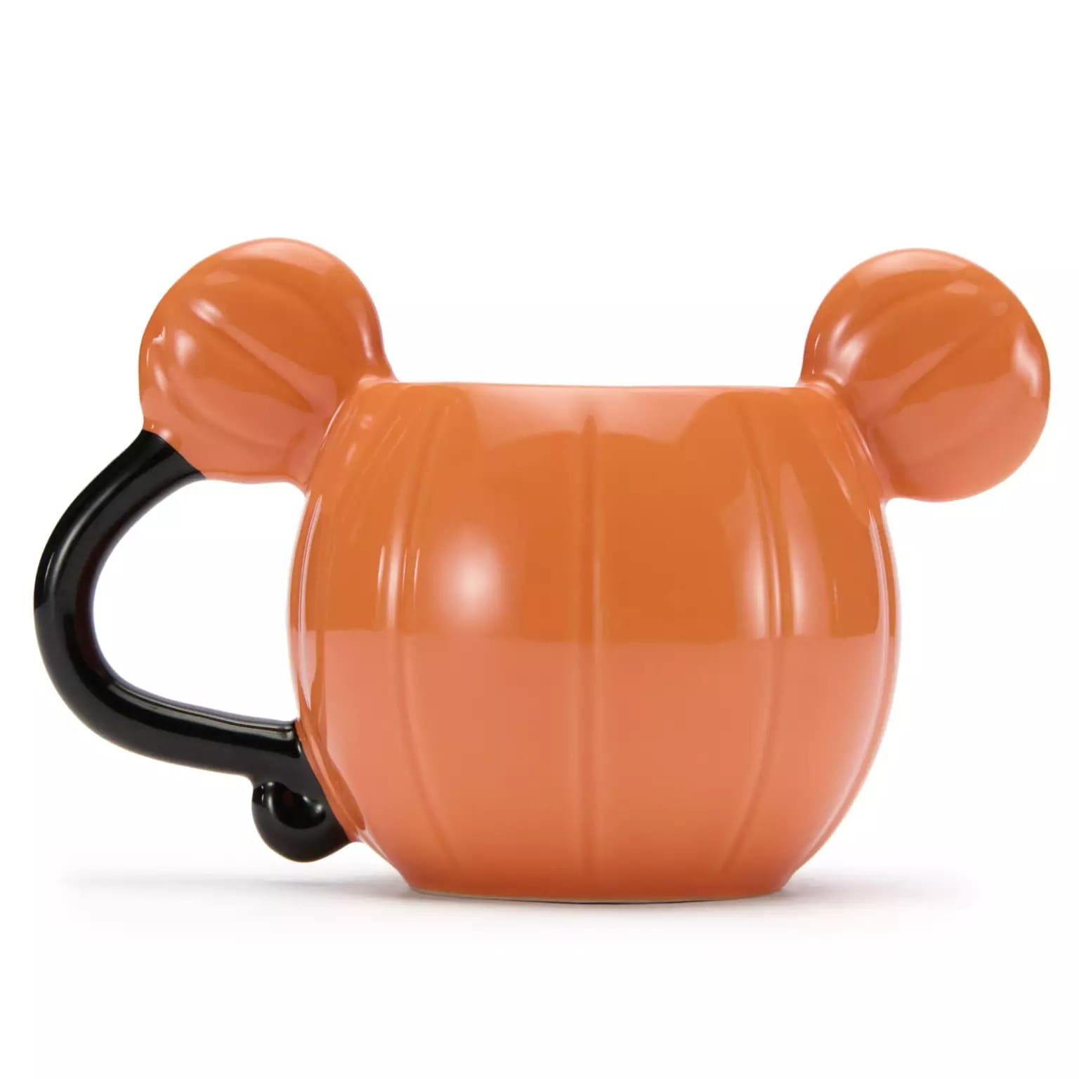 Orange pumpkin-shaped mug with black handle, resembling Mickey Mouse—part of Disney Store Halloween merchandise.