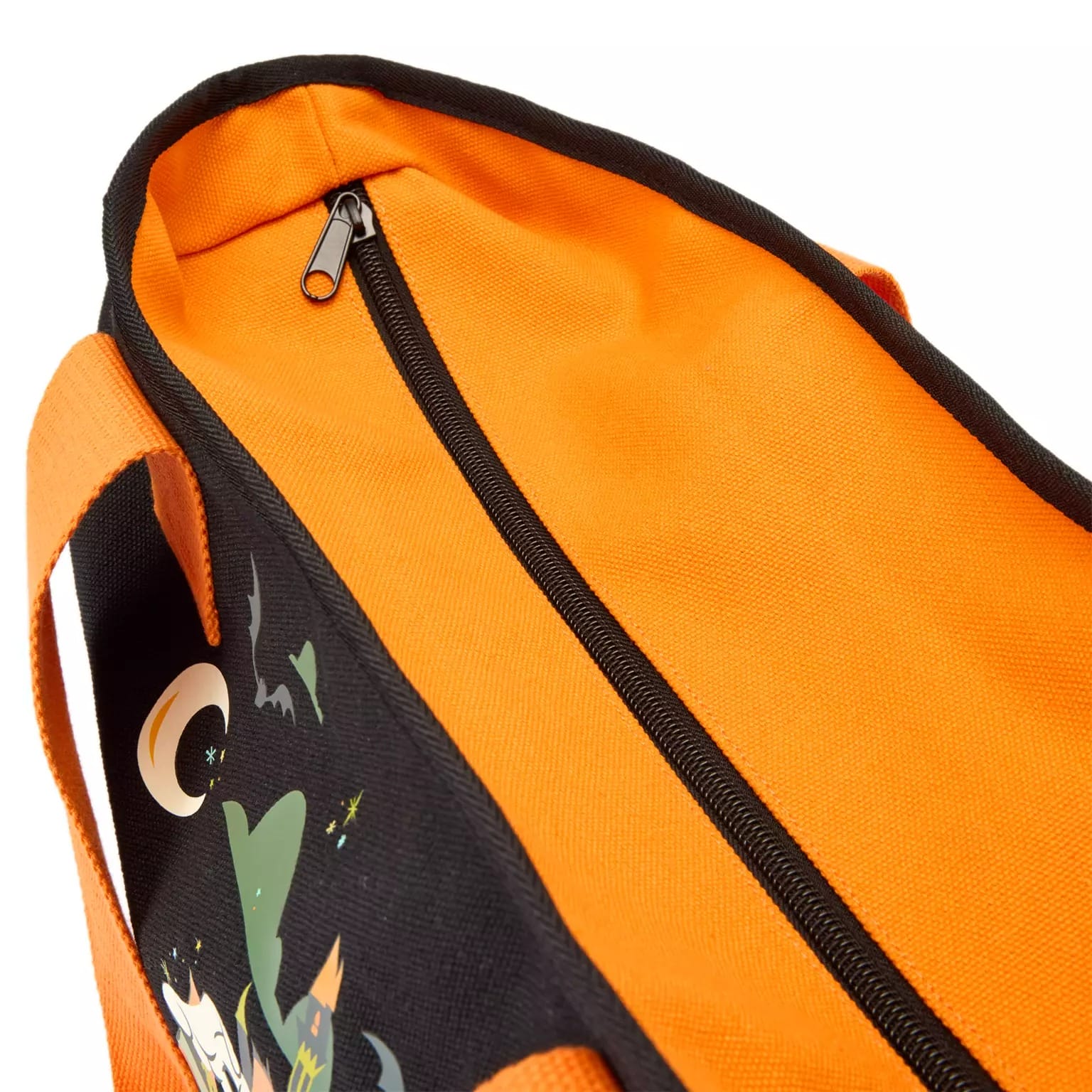 Close-up of an orange tote bag with a black zipper, part of the Disney Store Halloween merchandise collection.