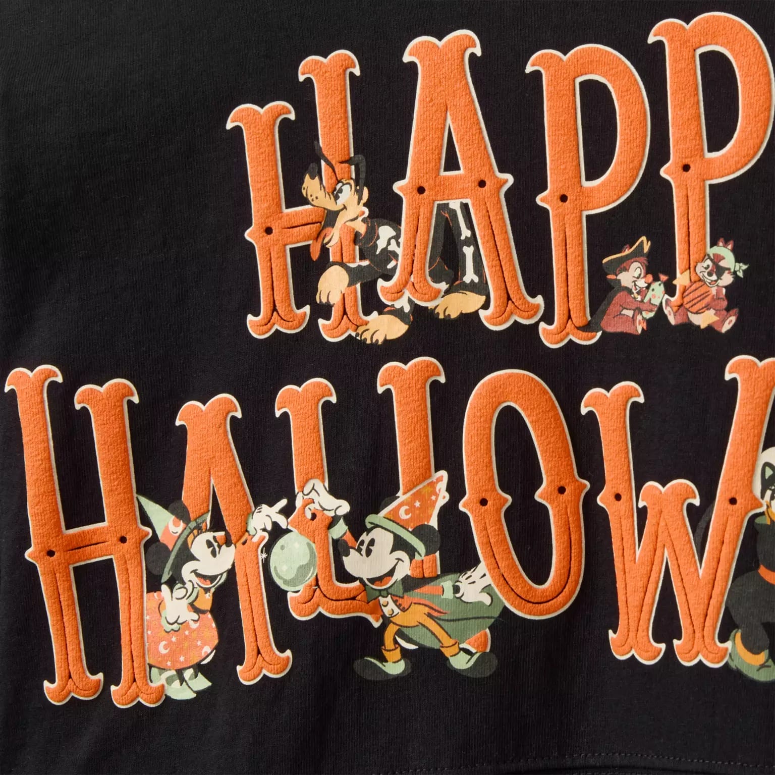 Black shirt with "Happy Halloween" in orange, Disney characters, and Disney Store Halloween merchandise flair.