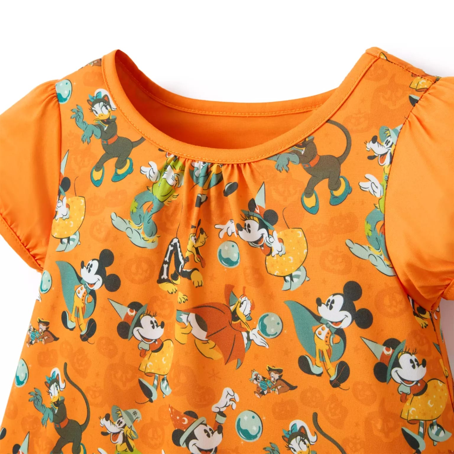 Orange shirt with short sleeves featuring Halloween Merchandise and Mickey & friends in festive costumes.