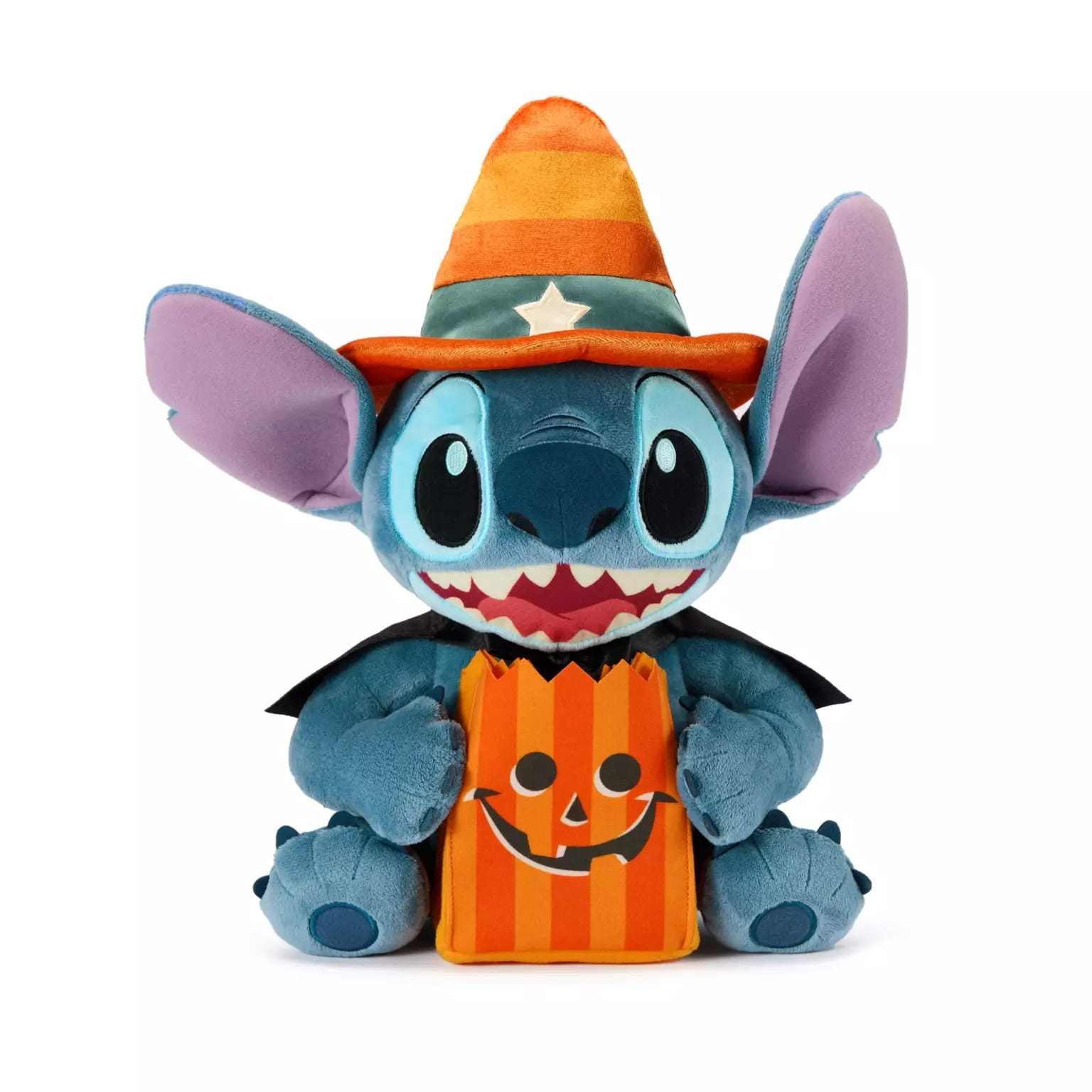 A plush blue alien toy in a witch hat and cape, holding a pumpkin bag—classic Disney Store Halloween merchandise.