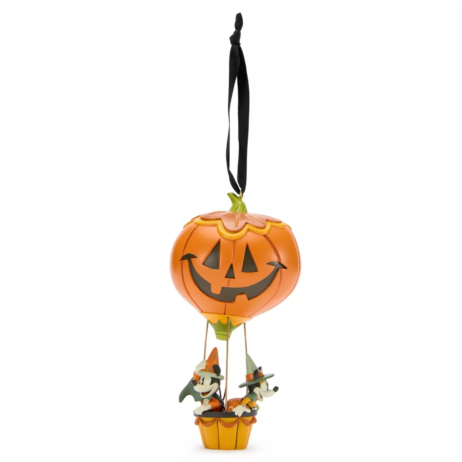 Two cartoon dogs in witch hats ride a jack-o’-lantern balloon, inspired by new Disney Halloween products.