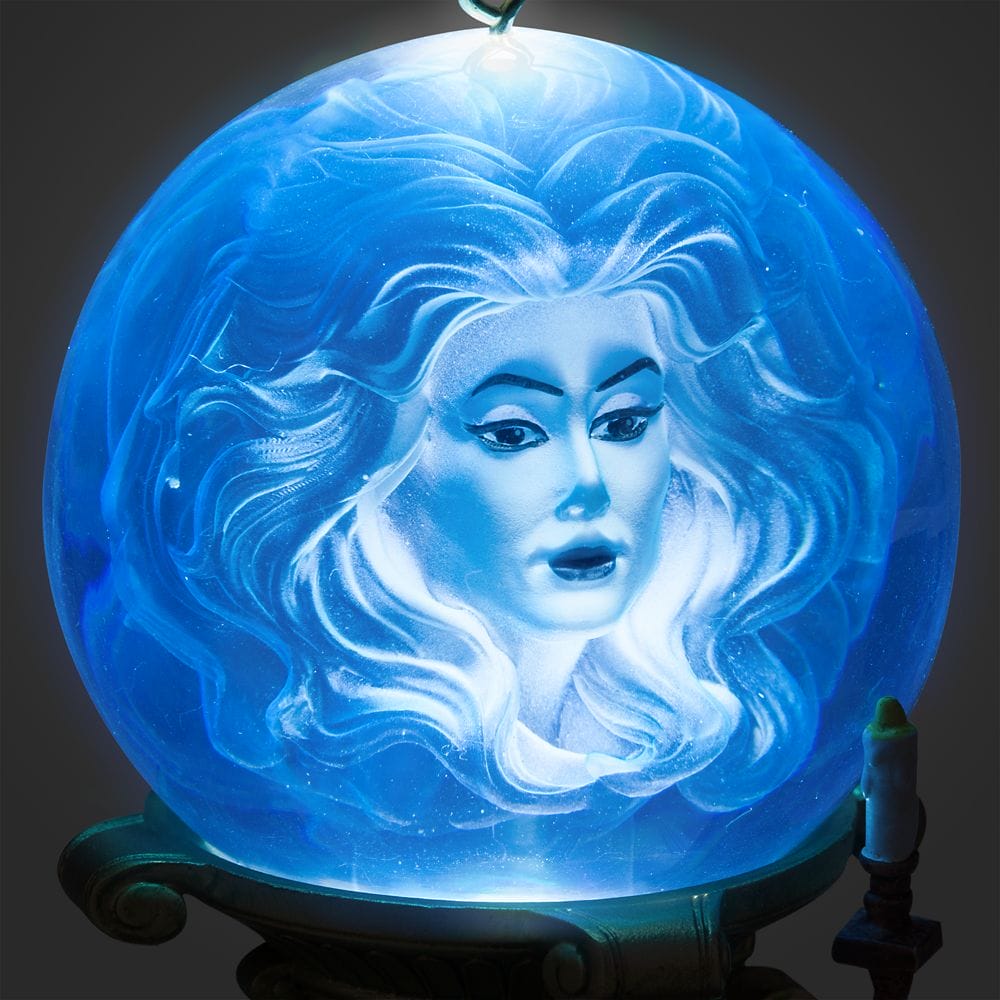 A blue glowing crystal ball with an ethereal woman's face, inspired by the Haunted Mansion Collection.