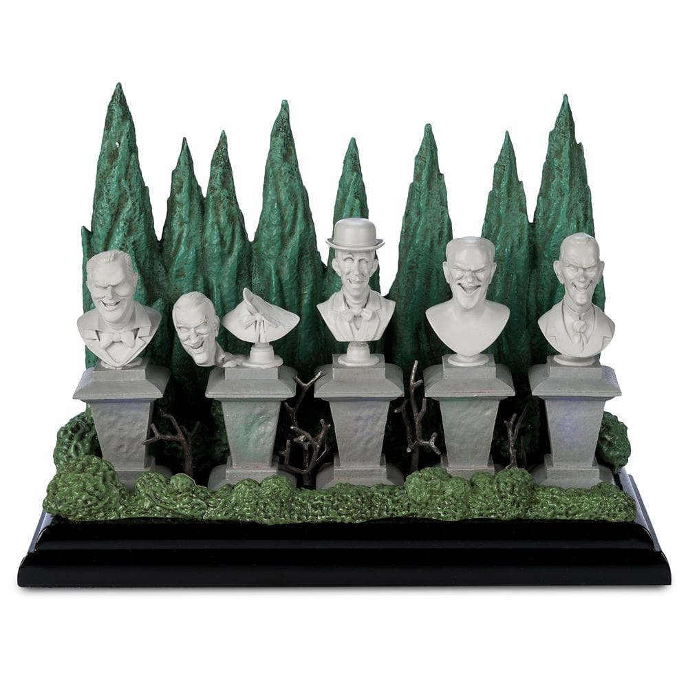 Five stone busts on pedestals with green trees, from the Haunted Mansion Collection at the Disney Store.