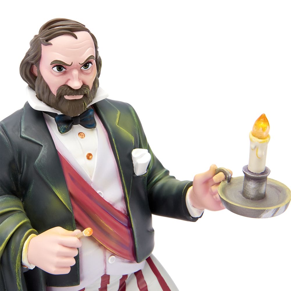 A figurine of a stern man in formal attire holding a lit candle, inspired by the Haunted Mansion Collection.