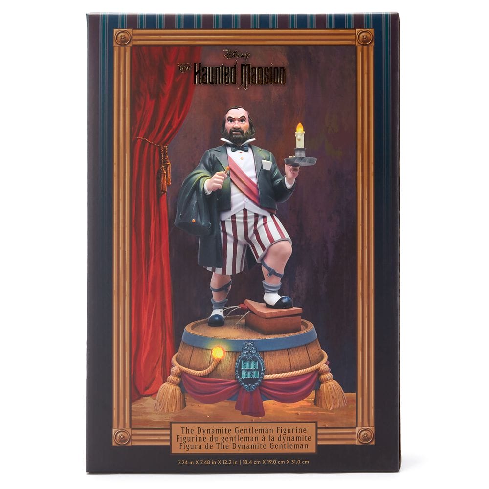 A figurine from the Haunted Mansion Collection features the Dynamite Gentleman on stage holding a candle.