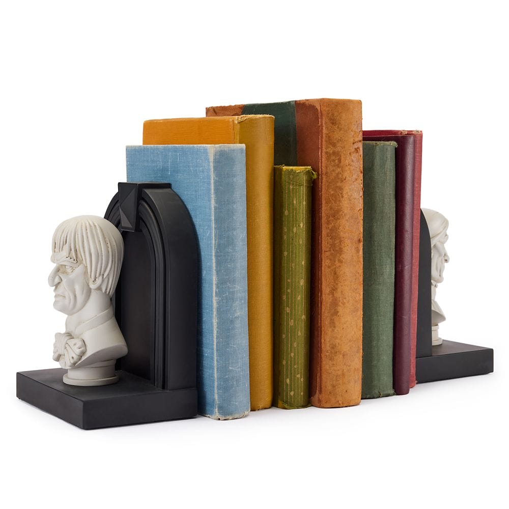 A set of colorful vintage books held upright by black bookends from the Haunted Mansion Collection.