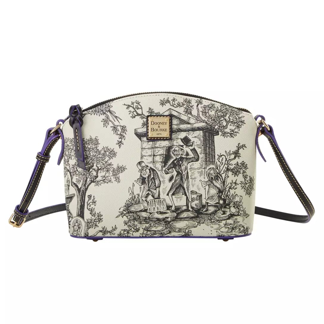 Cream crossbody bag with black toile-style illustration, part of the Haunted Mansion Collection at Disney Store.