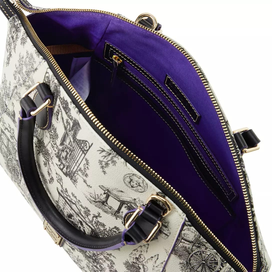 Open purse with black handles, gold hardware, purple lining, and scenic illustrations from the Haunted Mansion Collection.